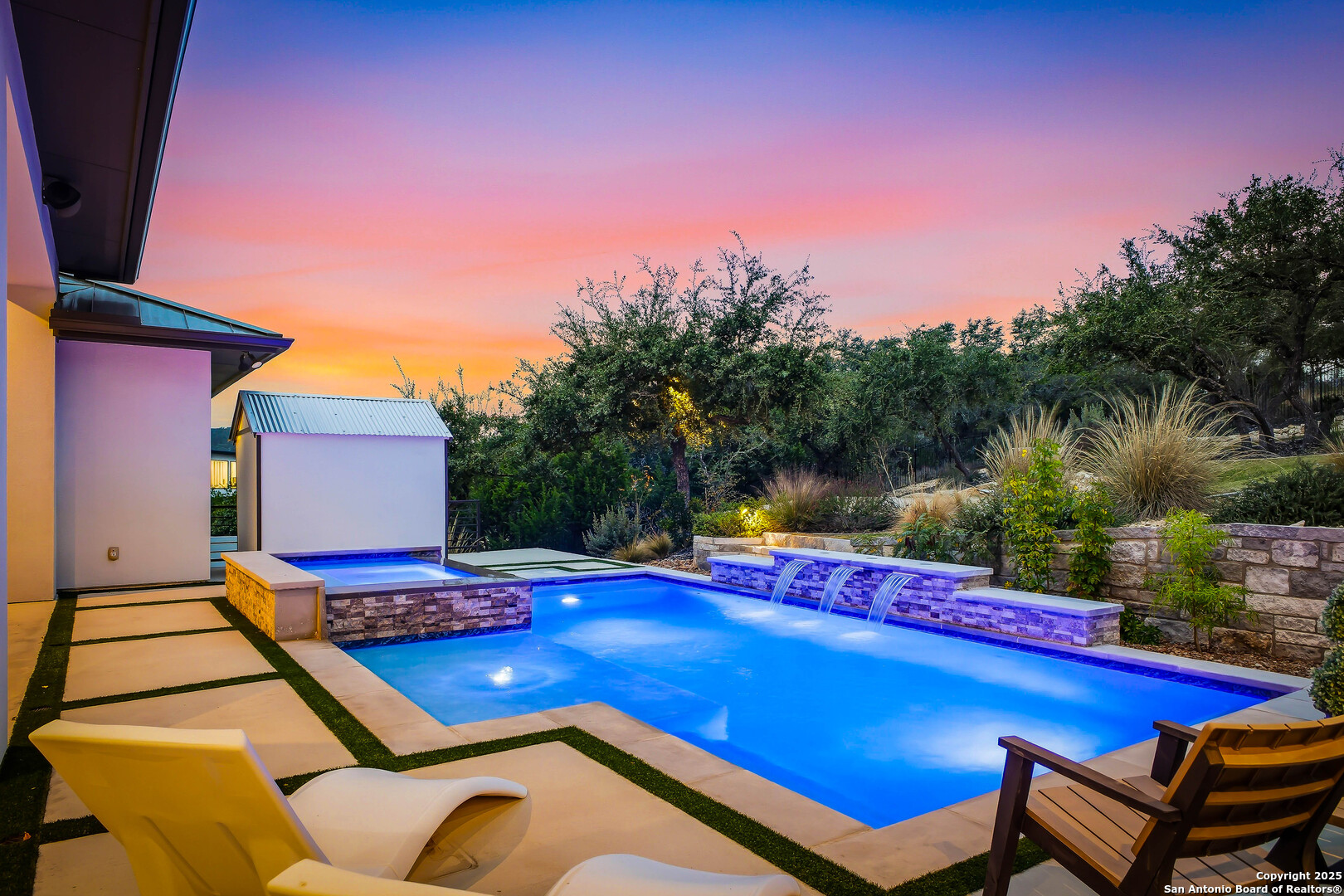 23315 Ebner Ridge San Antonio, TX 78255 - Photo 83 of 103 a view of a pool with a table and chairs