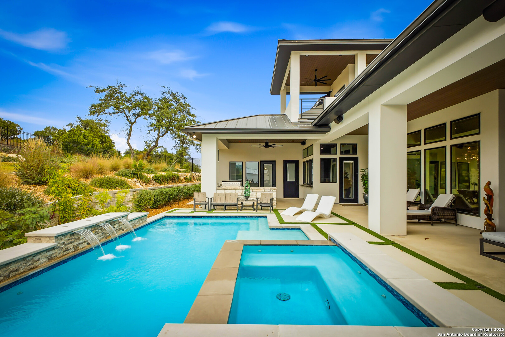 23315 Ebner Ridge San Antonio, TX 78255 - Photo 91 of 103 a view of swimming pool with lounge chair and floor to ceiling window