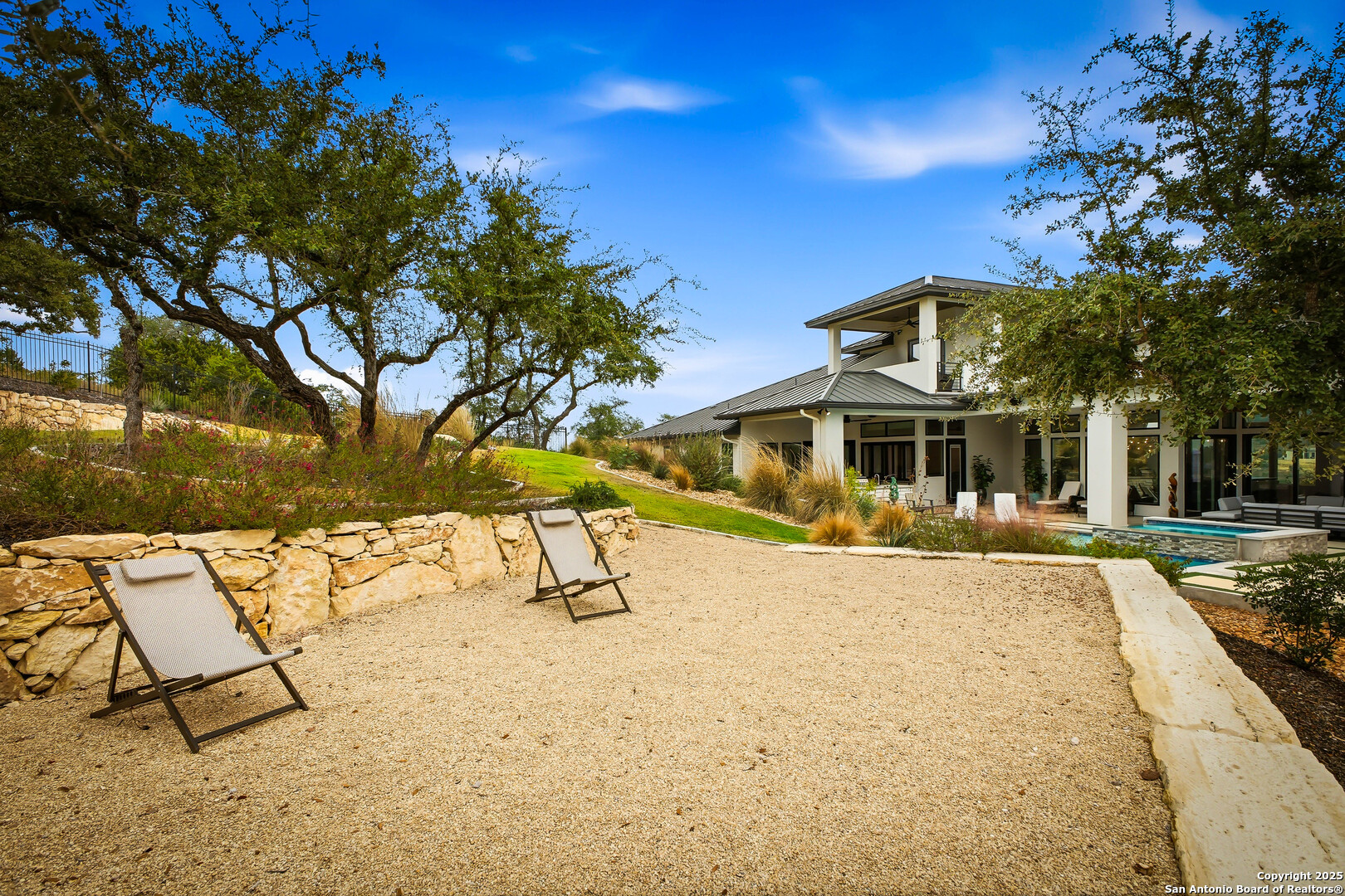 23315 Ebner Ridge San Antonio, TX 78255 - Photo 93 of 103 a view of a house with a yard