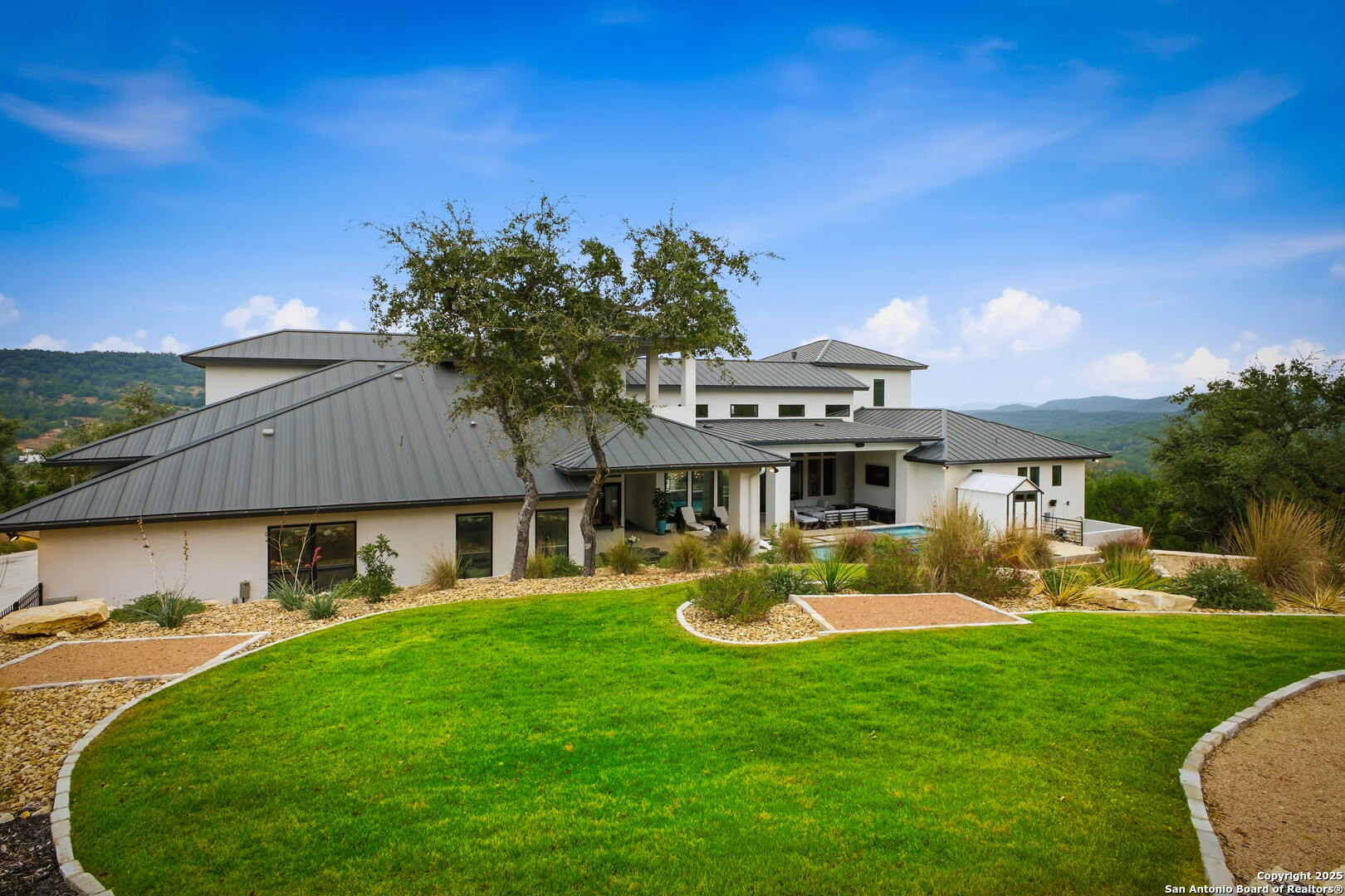 23315 Ebner Ridge San Antonio, TX 78255 - Photo 95 of 103 a front view of a house with garden