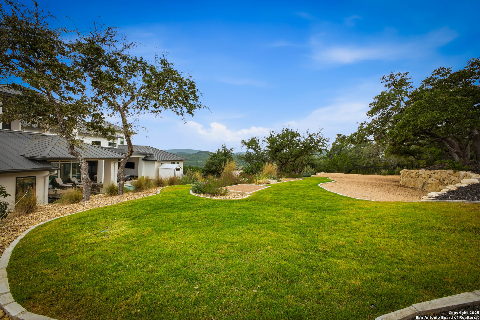 23315 Ebner Ridge San Antonio, TX 78255 - Photo 96 of 103 a view of a house with a yard