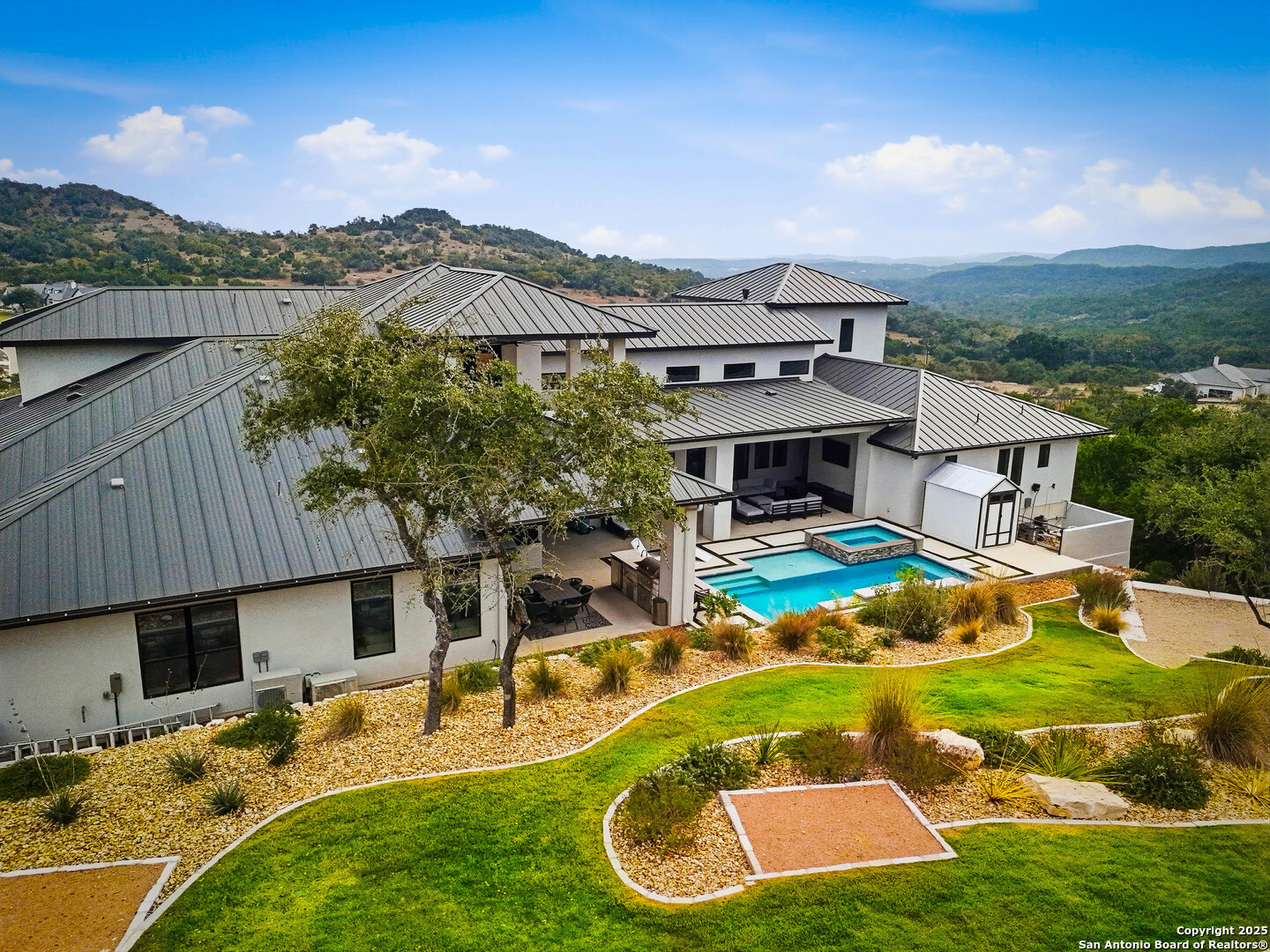 23315 Ebner Ridge San Antonio, TX 78255 - Photo 98 of 103 an aerial view of a house with swimming pool garden and patio