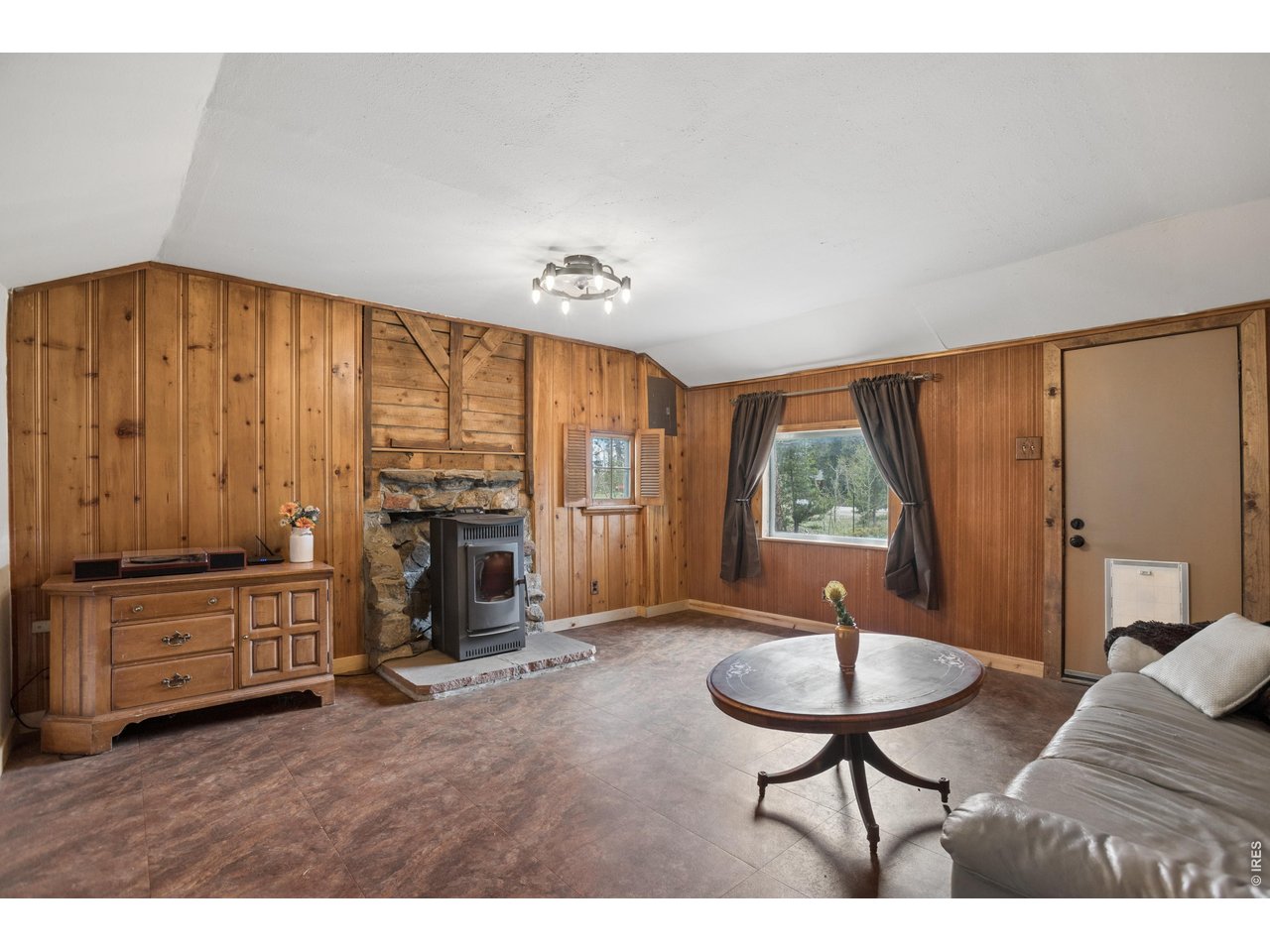 27 Gap Road Black Hawk, CO 80422 - Photo 2 of 36 a living room with furniture fireplace and window