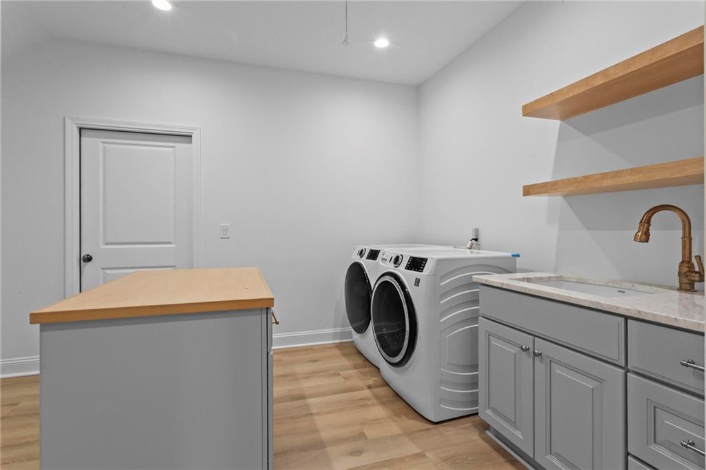 2630 Old Atlanta Road Cumming, GA 30041 - Photo 47 of 87 a utility room with sink dryer and washer