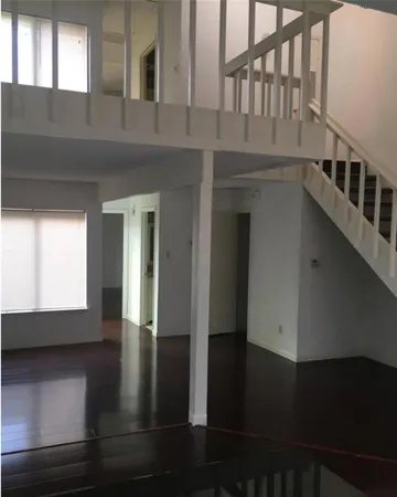 a view of an entryway with wooden floor