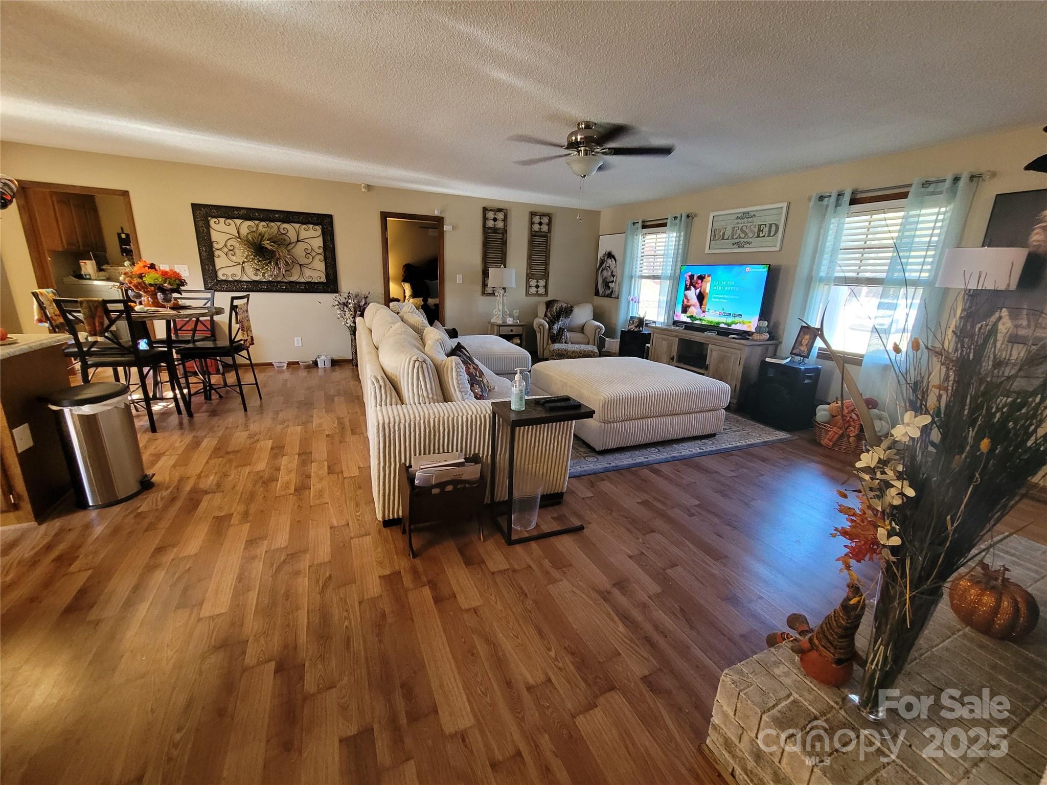 1349 High Shoals Road Lincolnton, NC 28092 - Photo 11 of 42 a living room with furniture and a wooden floor