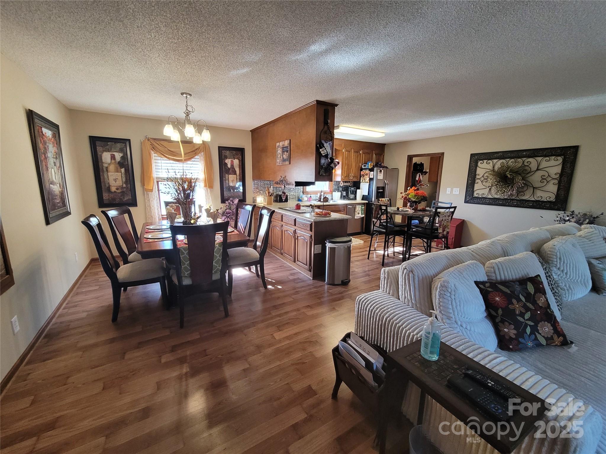 1349 High Shoals Road Lincolnton, NC 28092 - Photo 12 of 42 a view of a dining room with furniture window and wooden floor