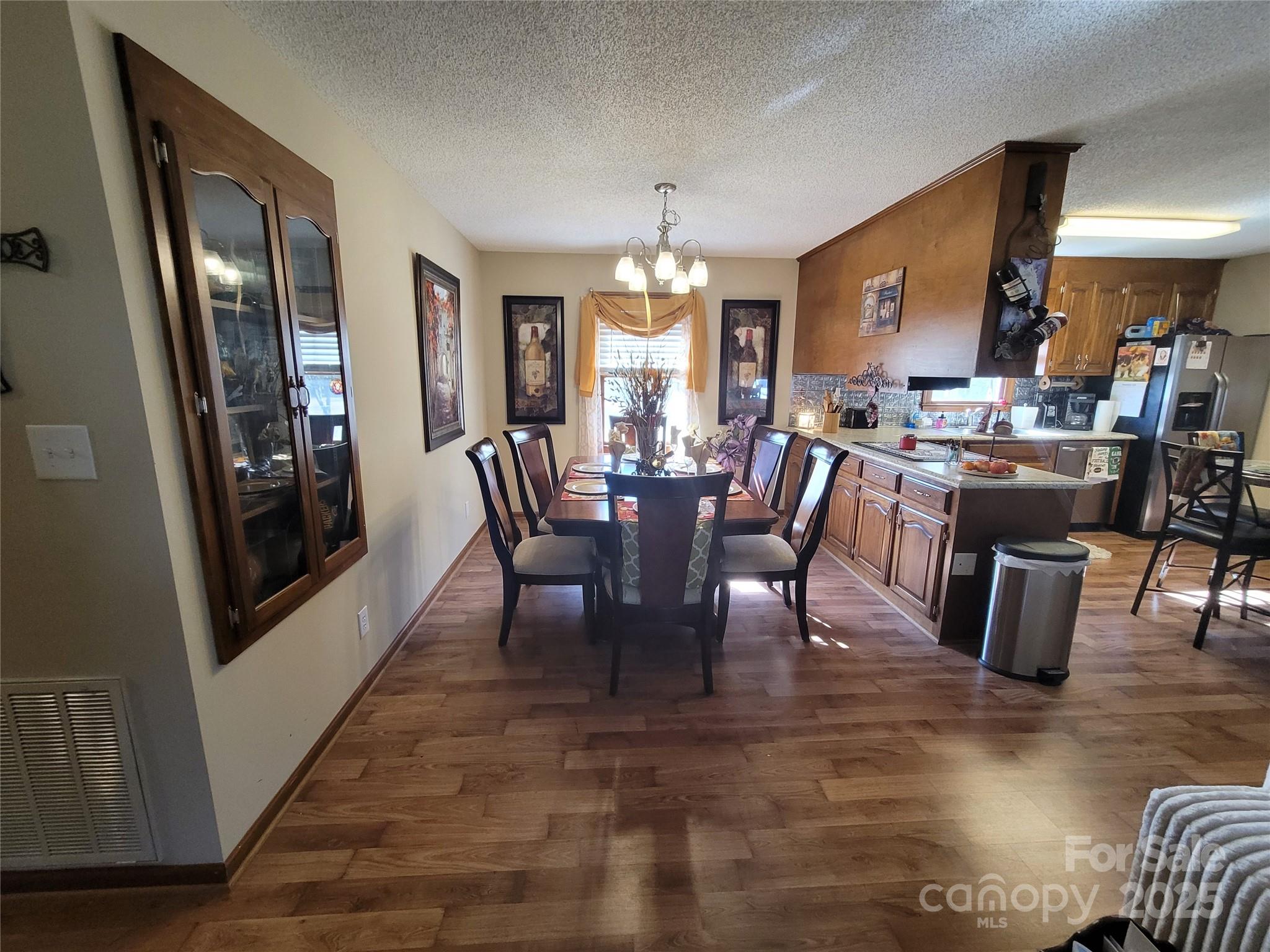 1349 High Shoals Road Lincolnton, NC 28092 - Photo 13 of 42 a view of a dining room with furniture window and wooden floor