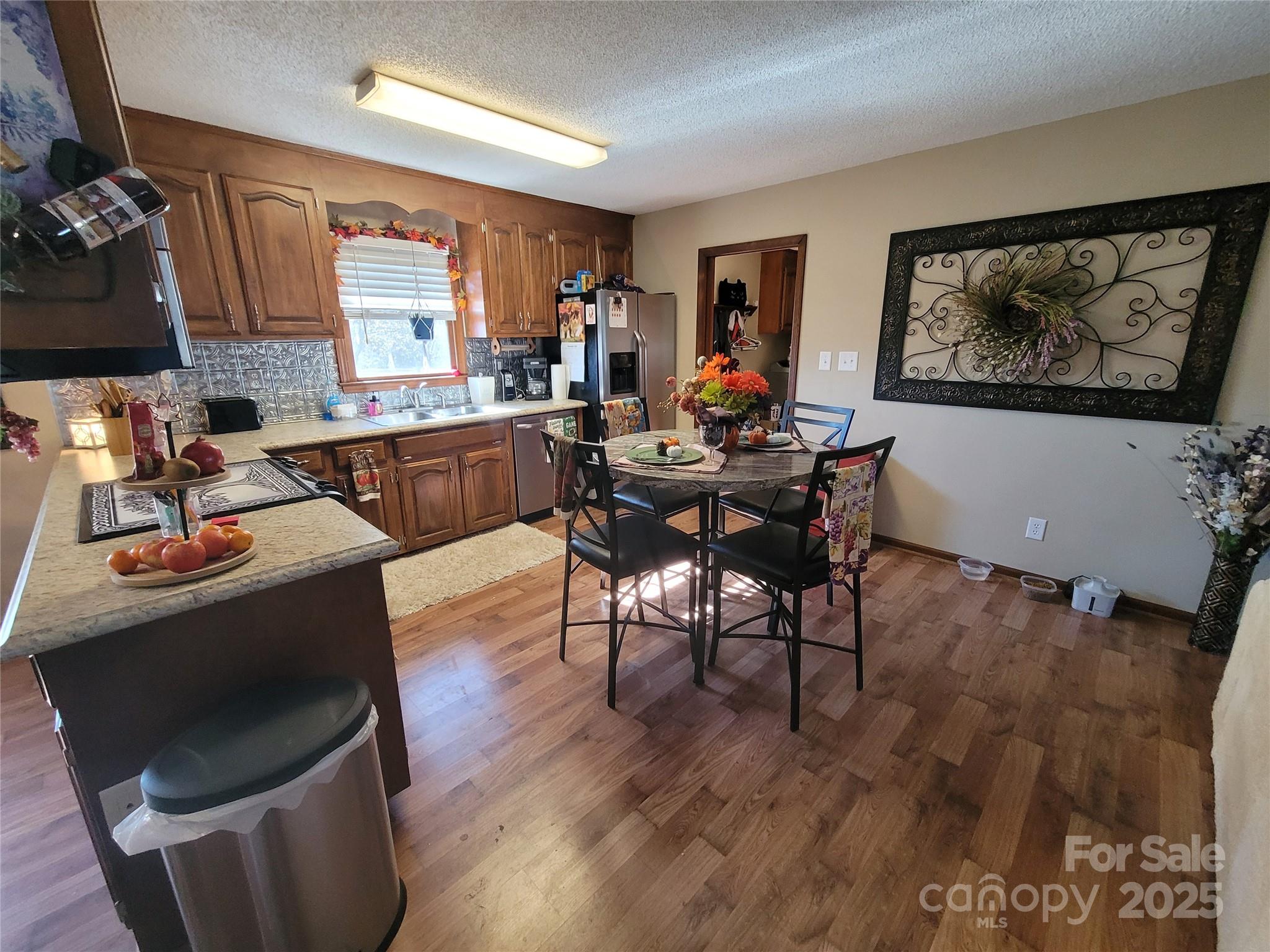 1349 High Shoals Road Lincolnton, NC 28092 - Photo 14 of 42 a living room with furniture a flat screen tv and a stove