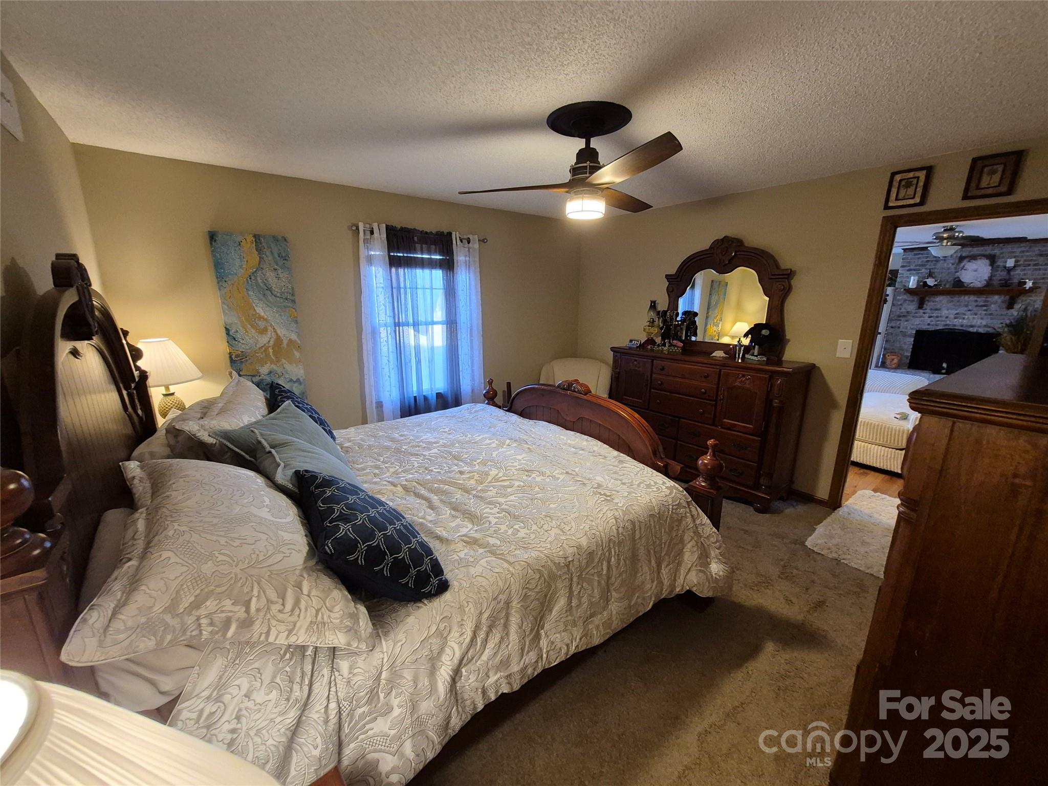 1349 High Shoals Road Lincolnton, NC 28092 - Photo 16 of 42 a bedroom with a bed and wooden floor