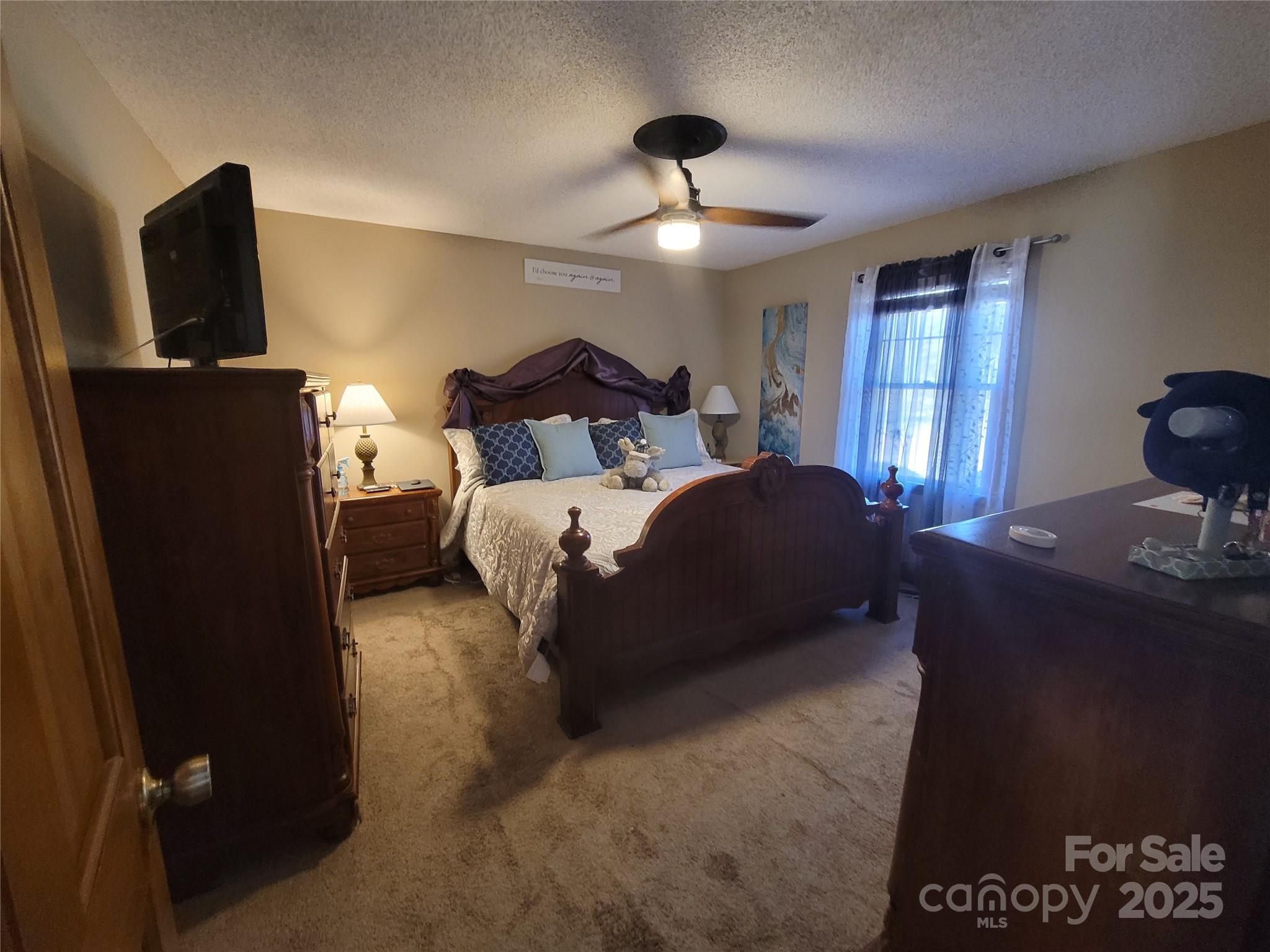 1349 High Shoals Road Lincolnton, NC 28092 - Photo 18 of 42 a bedroom with bed mirror and window