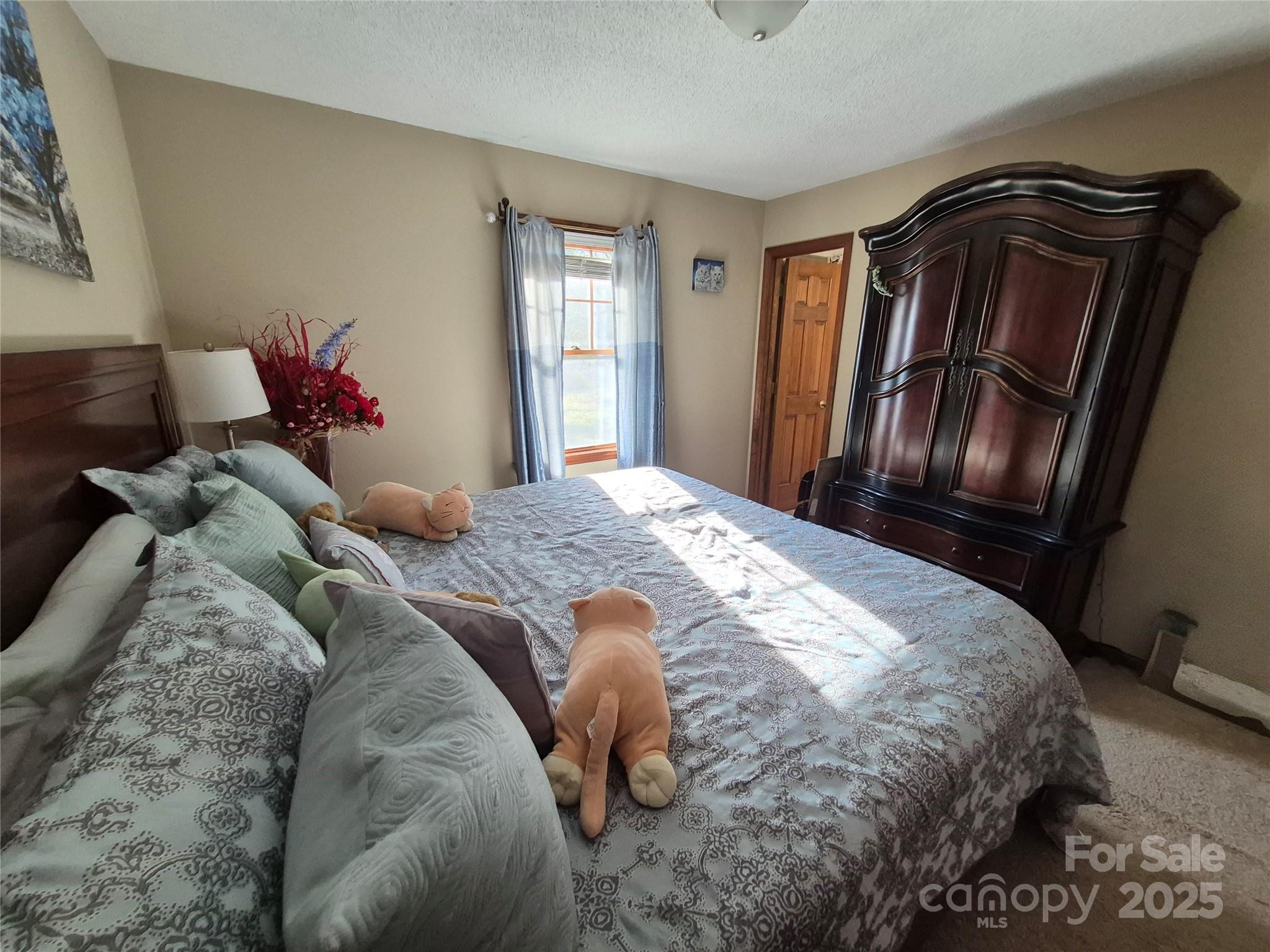 1349 High Shoals Road Lincolnton, NC 28092 - Photo 22 of 42 a bedroom with a bed and wooden floor