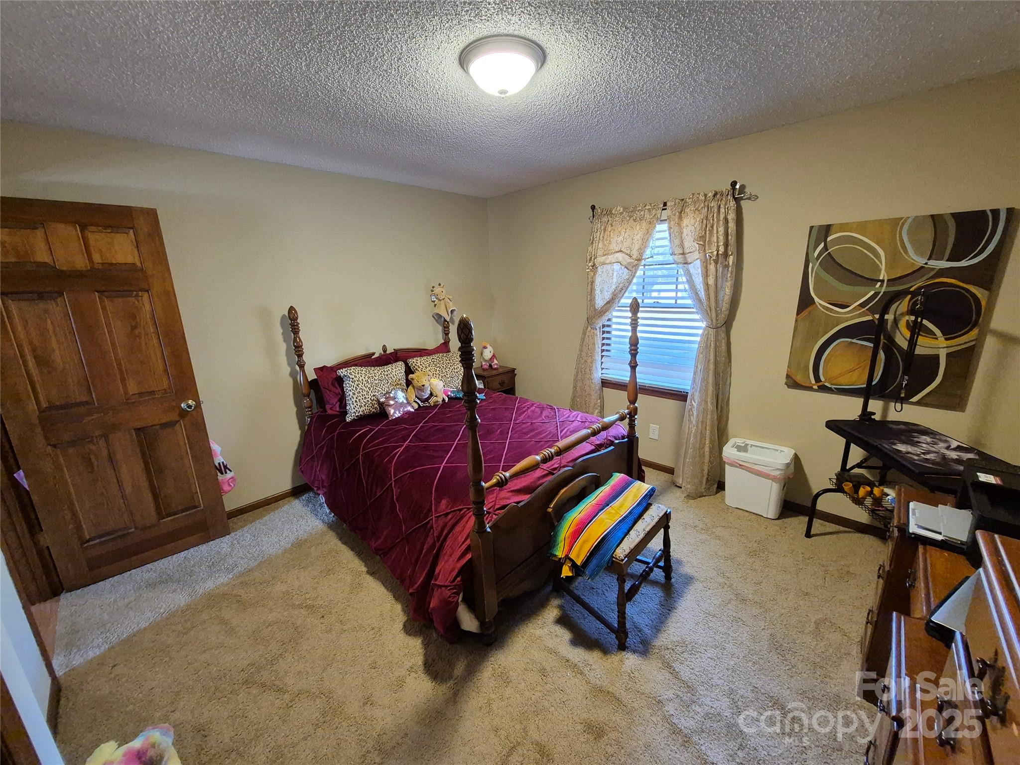 1349 High Shoals Road Lincolnton, NC 28092 - Photo 23 of 42 a bedroom with a bed and wooden floor