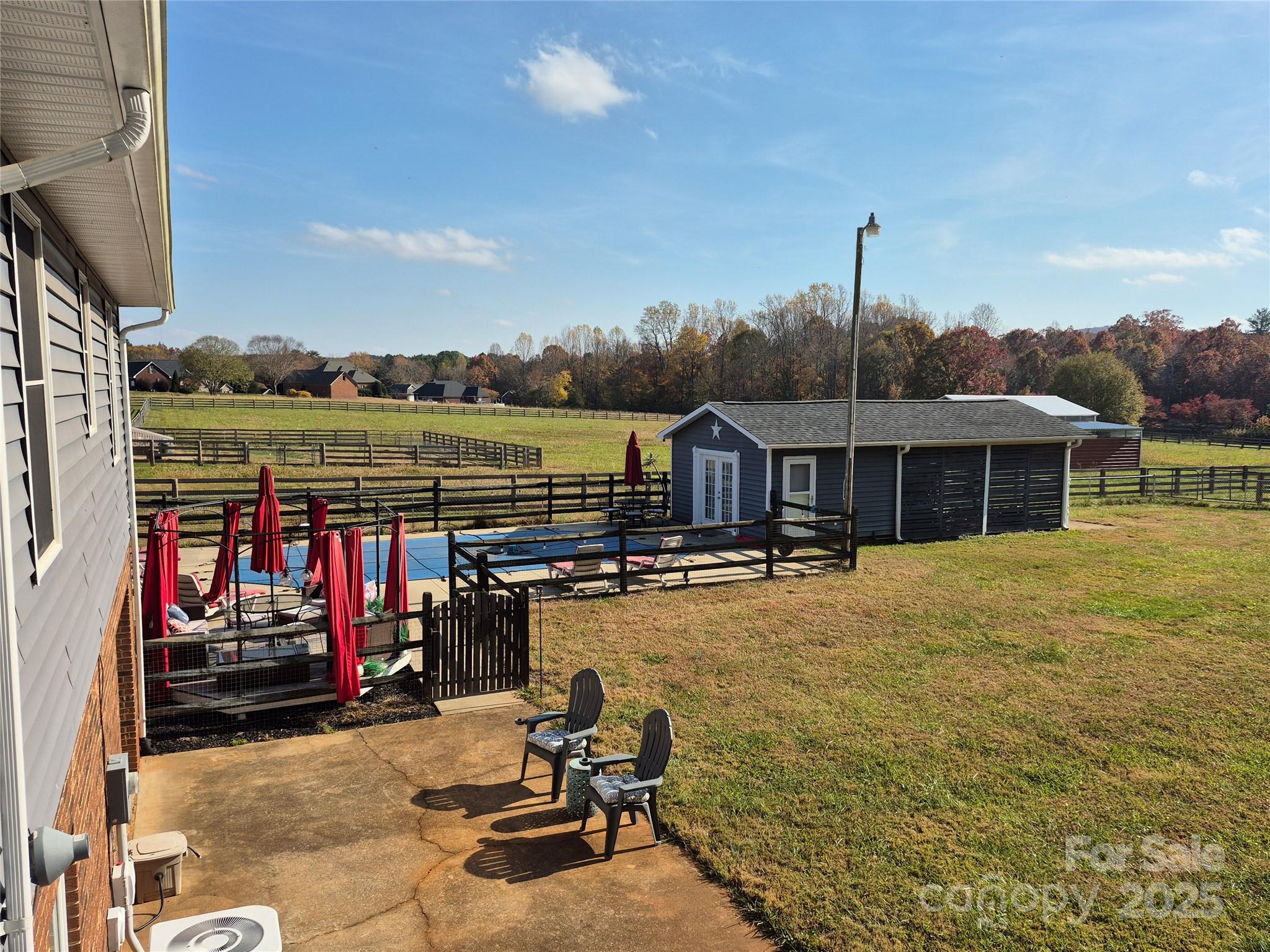 1349 High Shoals Road Lincolnton, NC 28092 - Photo 40 of 42 a view of a house with swimming pool and sitting area
