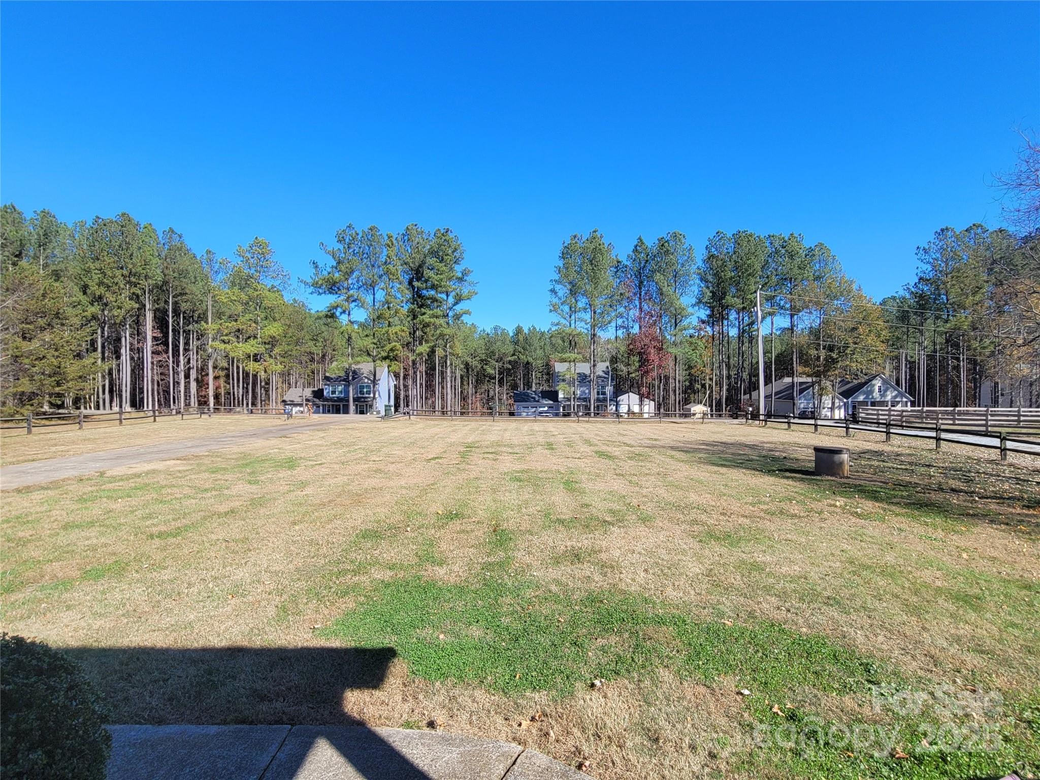 1349 High Shoals Road Lincolnton, NC 28092 - Photo 42 of 42 a view of swimming pool with outdoor seating and trees in the background