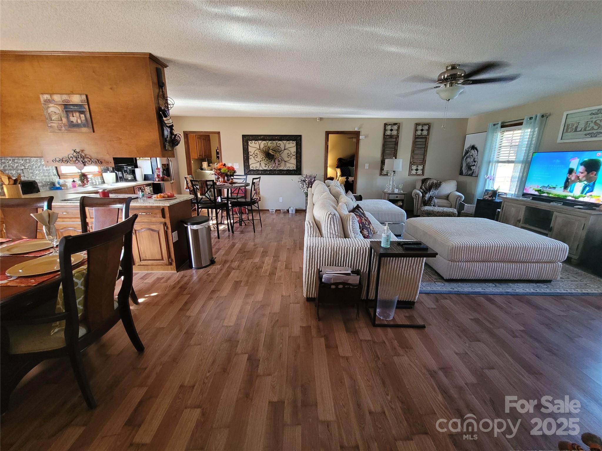 1349 High Shoals Road Lincolnton, NC 28092 - Photo 6 of 42 a living room with furniture dining table a lamp and a window
