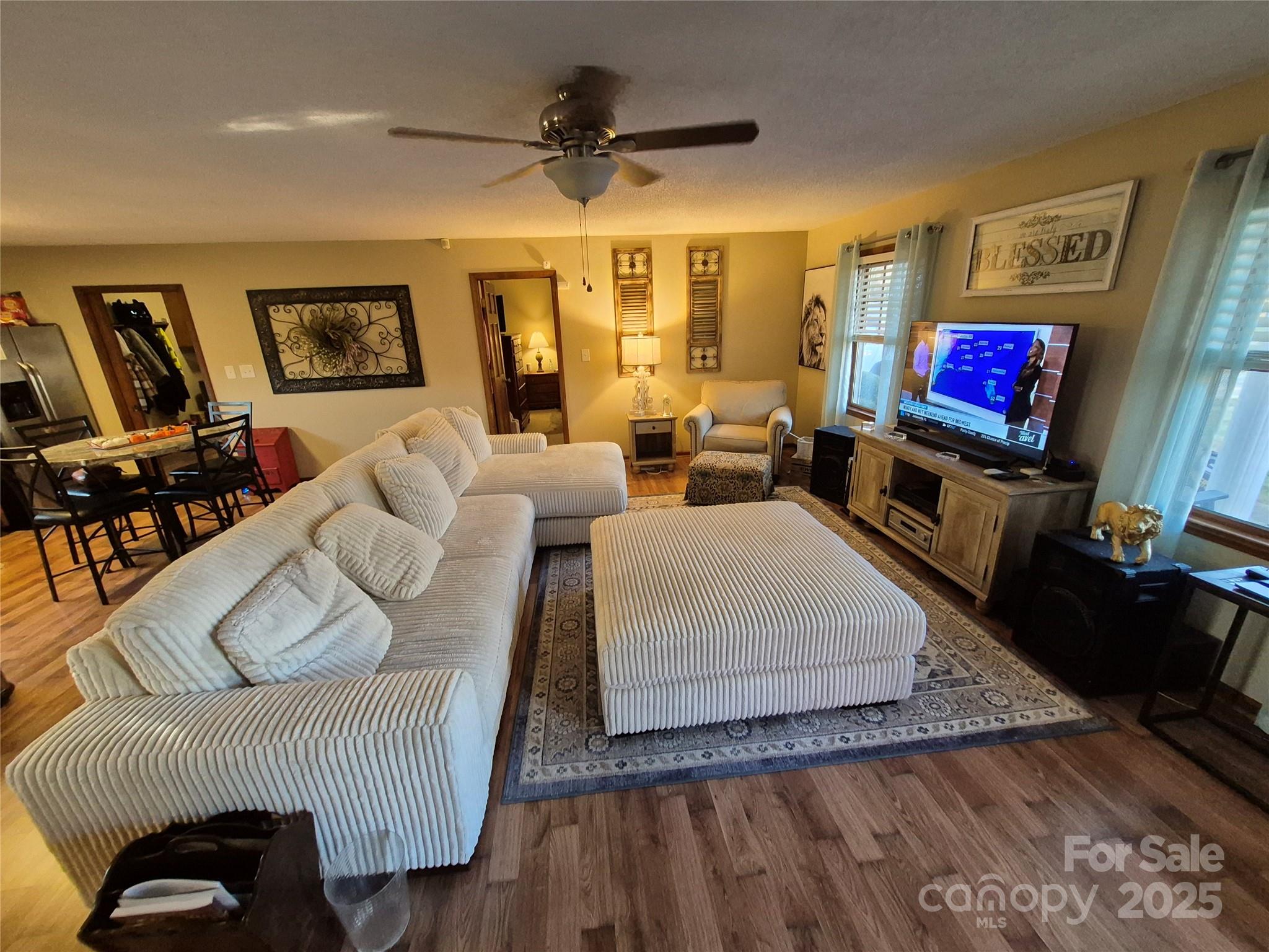 1349 High Shoals Road Lincolnton, NC 28092 - Photo 7 of 42 a living room with furniture and a flat screen tv