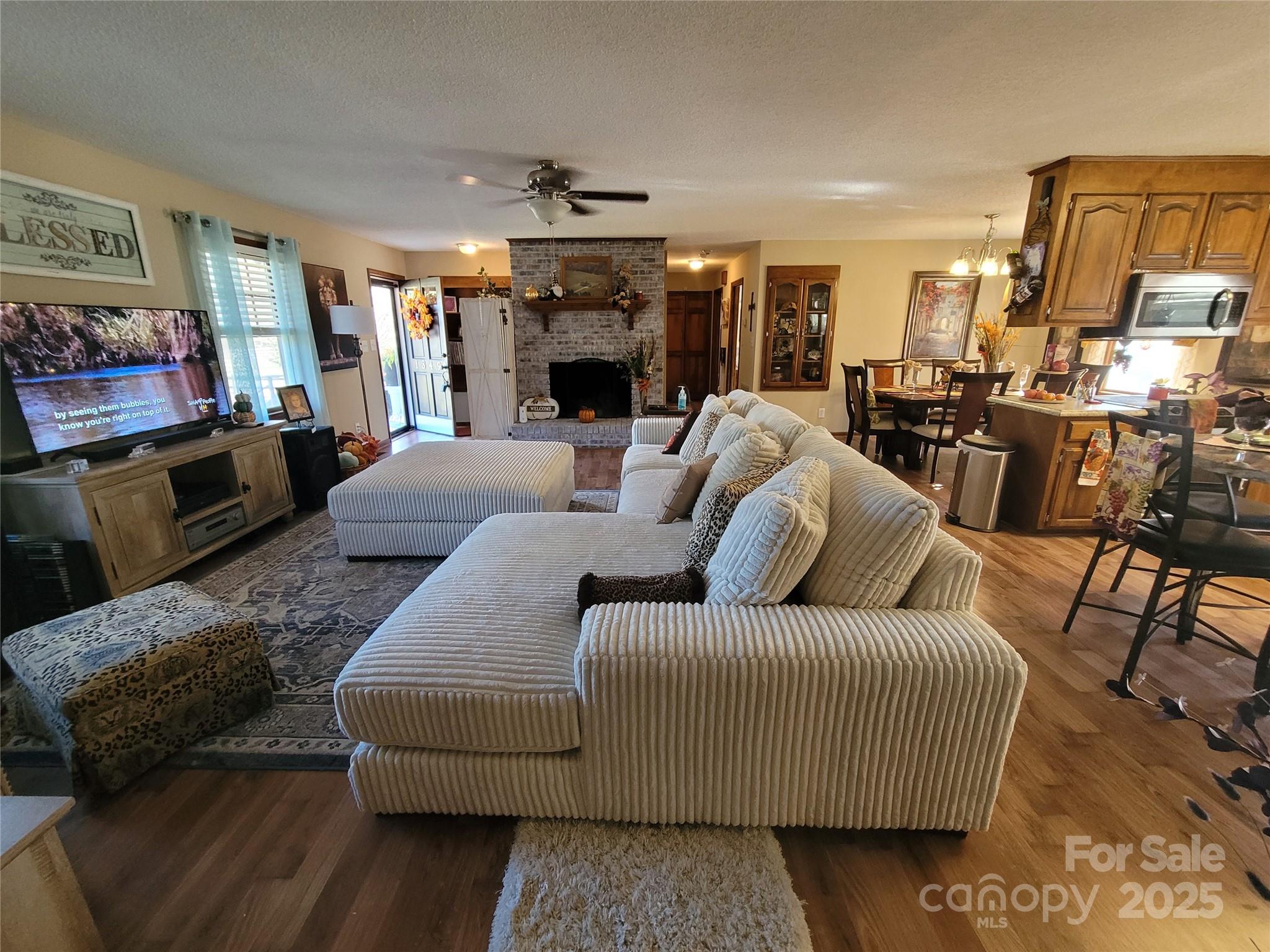 1349 High Shoals Road Lincolnton, NC 28092 - Photo 8 of 42 a living room with furniture and a flat screen tv