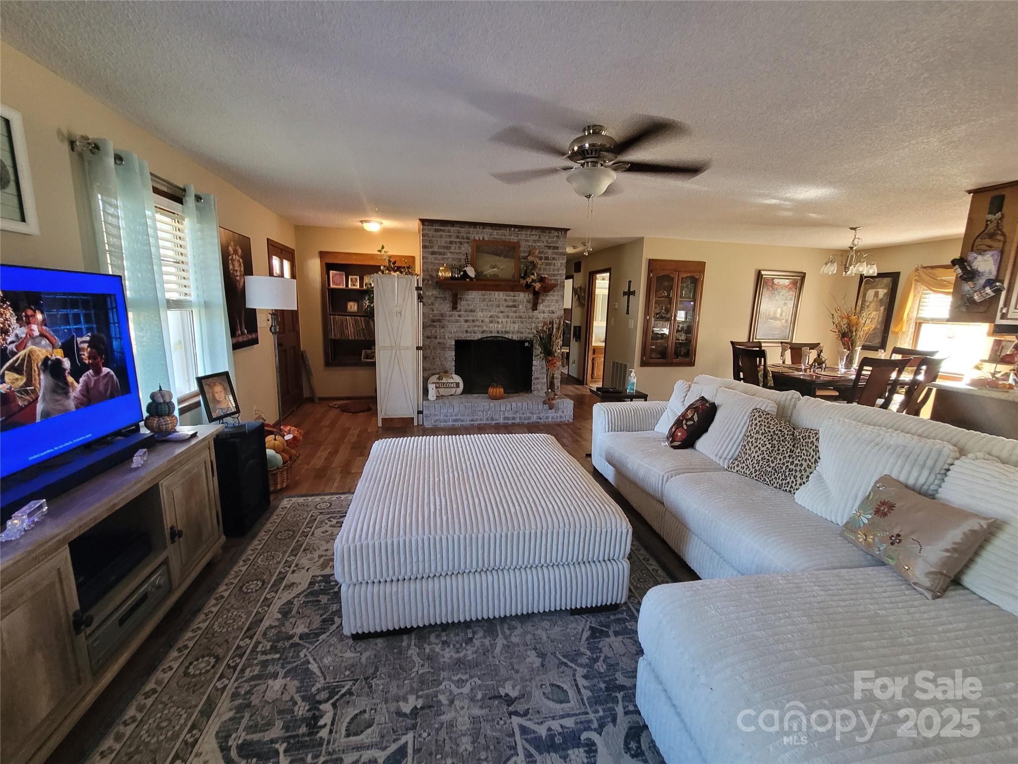 1349 High Shoals Road Lincolnton, NC 28092 - Photo 10 of 42 a bed room with furniture and a fireplace