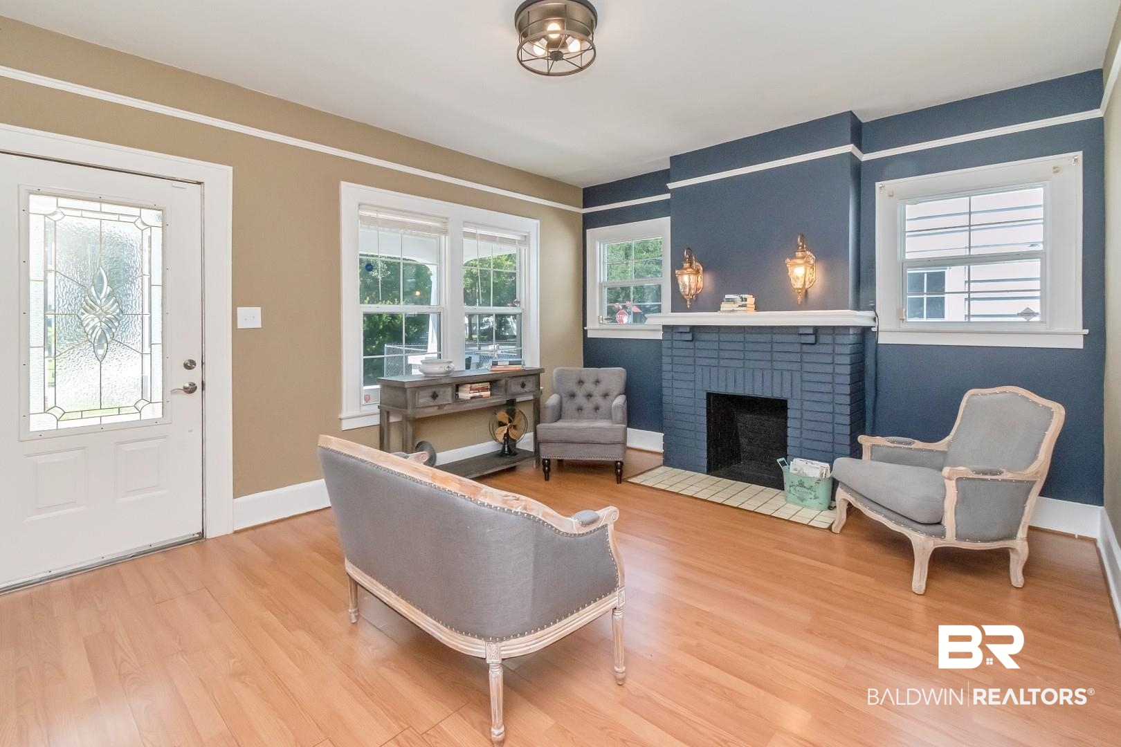653 Cherokee Street Mobile, AL 36606 - Photo 3 of 22 Entrance foyer featuring light wood-style flooring and a brick fireplace