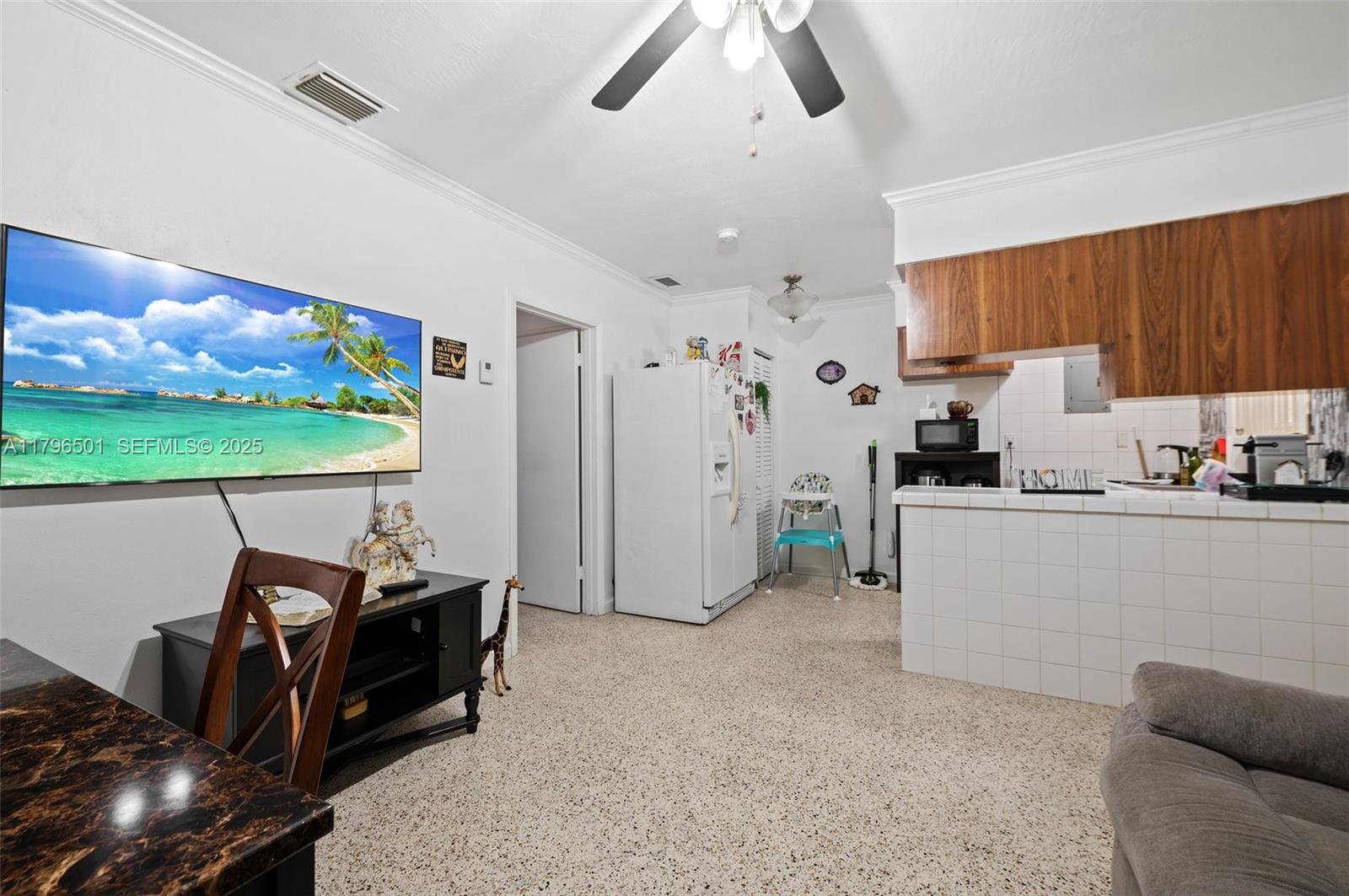 Hialeah Acres Hialeah, FL 33010 - Photo 18 of 55 a room with furniture and a flat screen tv