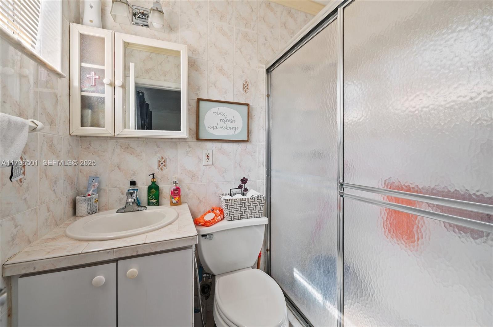 Hialeah Acres Hialeah, FL 33010 - Photo 25 of 55 a bathroom with a sink a toilet and shower