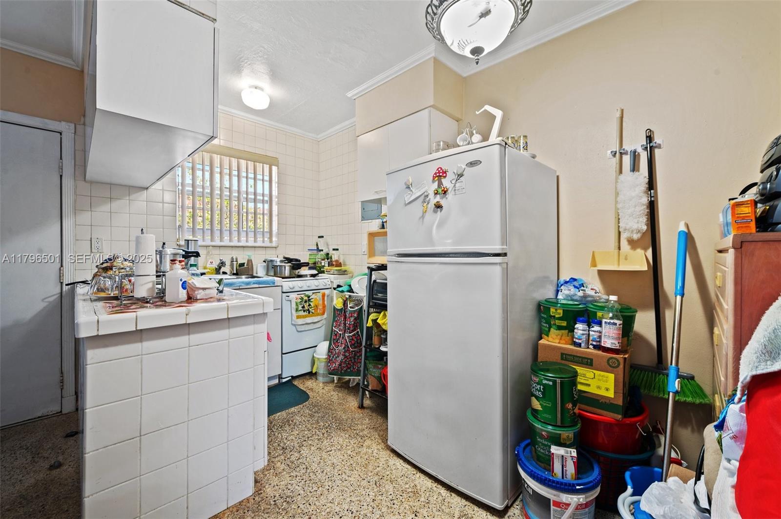 Hialeah Acres Hialeah, FL 33010 - Photo 31 of 55 a kitchen with stainless steel appliances a refrigerator sink and a window