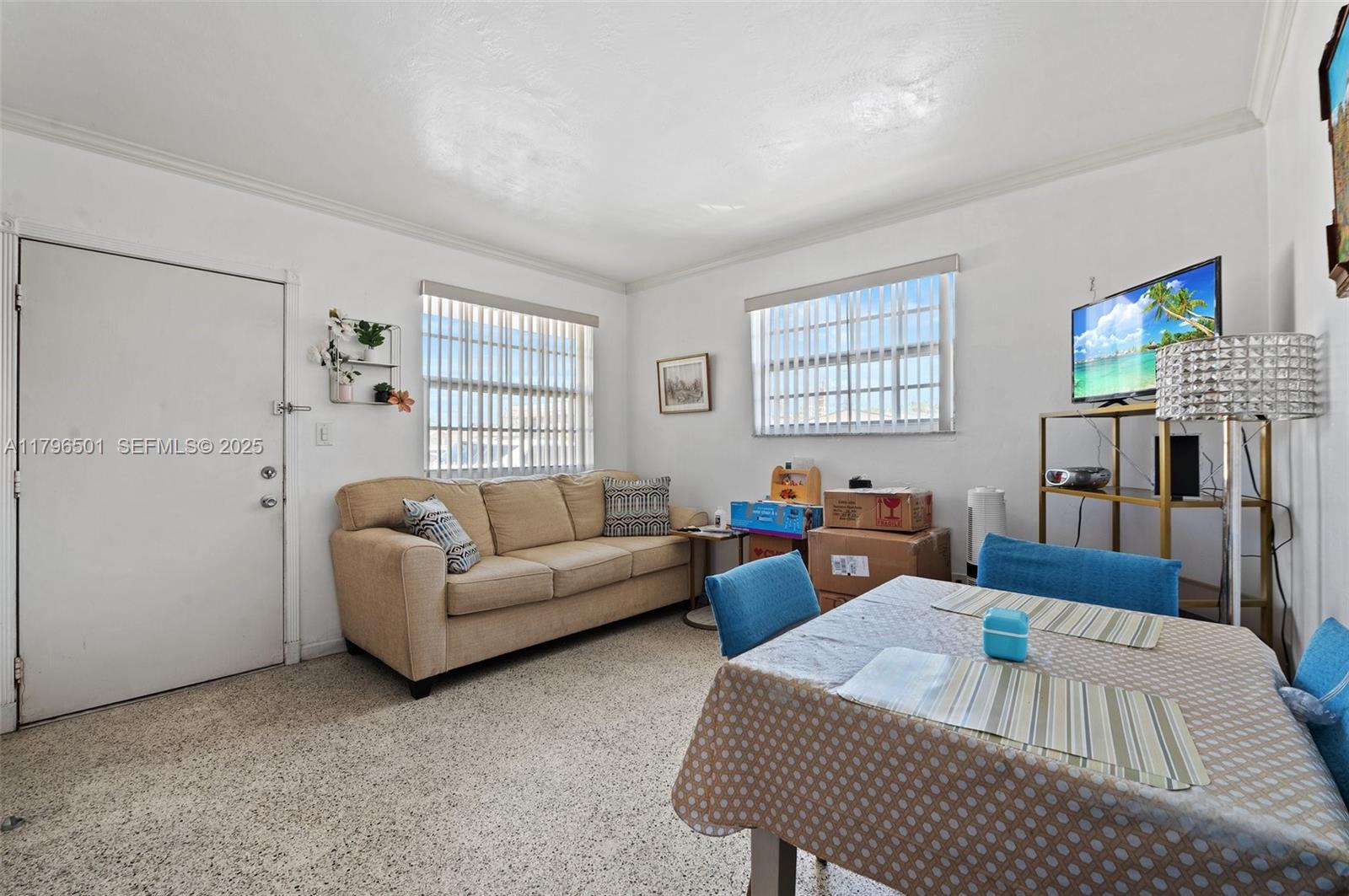 Hialeah Acres Hialeah, FL 33010 - Photo 37 of 55 a living room with furniture and a flat screen tv