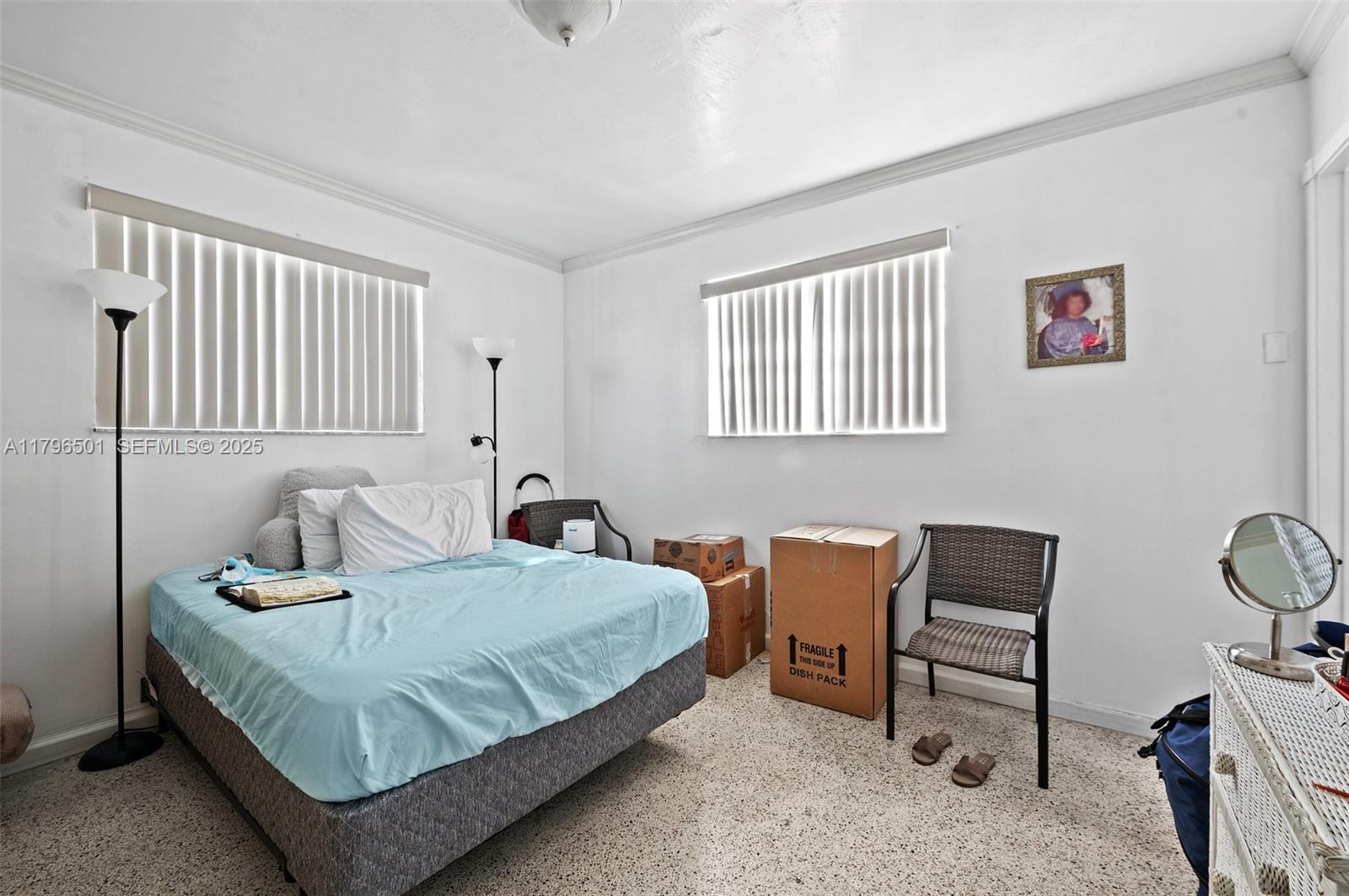 Hialeah Acres Hialeah, FL 33010 - Photo 43 of 55 a bedroom with a bed and a chair