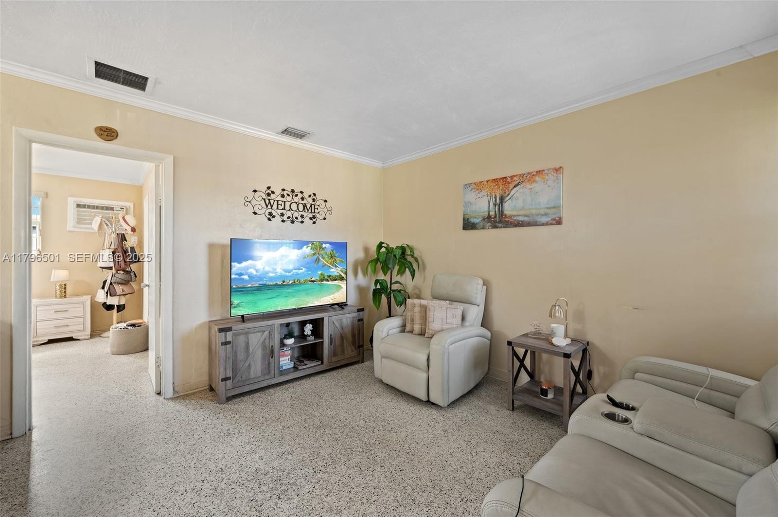 Hialeah Acres Hialeah, FL 33010 - Photo 5 of 55 a living room with furniture and a flat screen tv