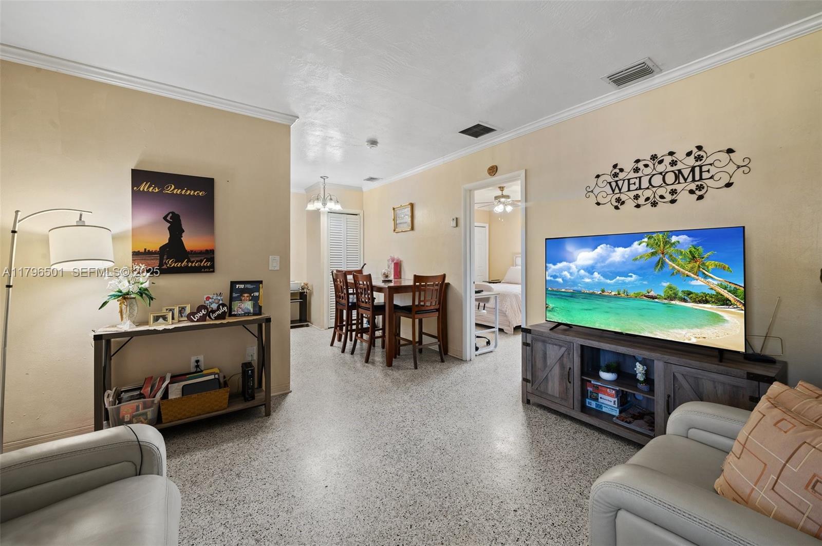 Hialeah Acres Hialeah, FL 33010 - Photo 8 of 55 a living room with furniture and a flat screen tv