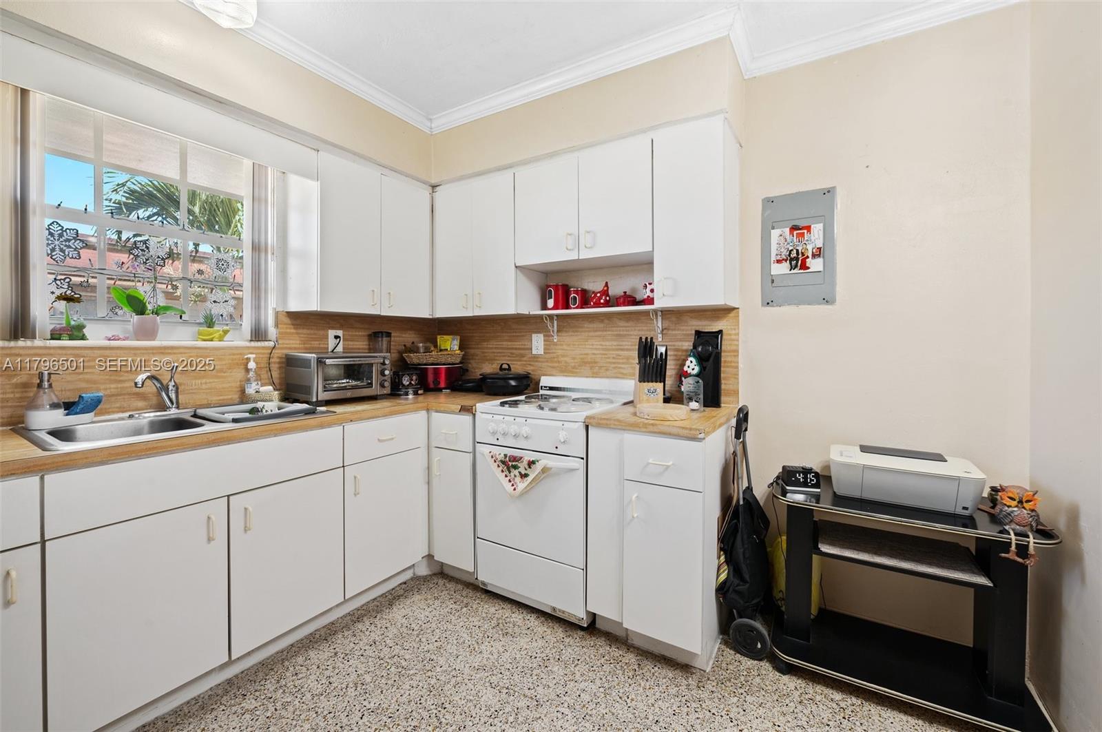 Hialeah Acres Hialeah, FL 33010 - Photo 9 of 55 a kitchen with a sink cabinets and window