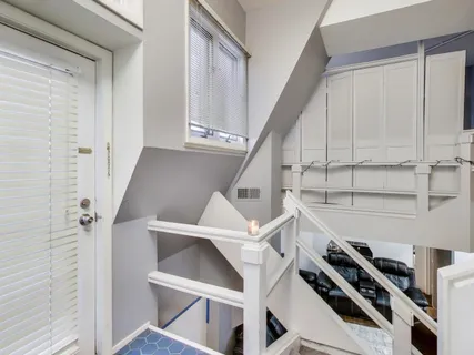 a view of an empty room with stairs