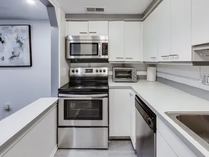 a kitchen with a stove and a microwave