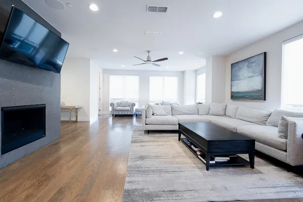 a living room with furniture and a fireplace