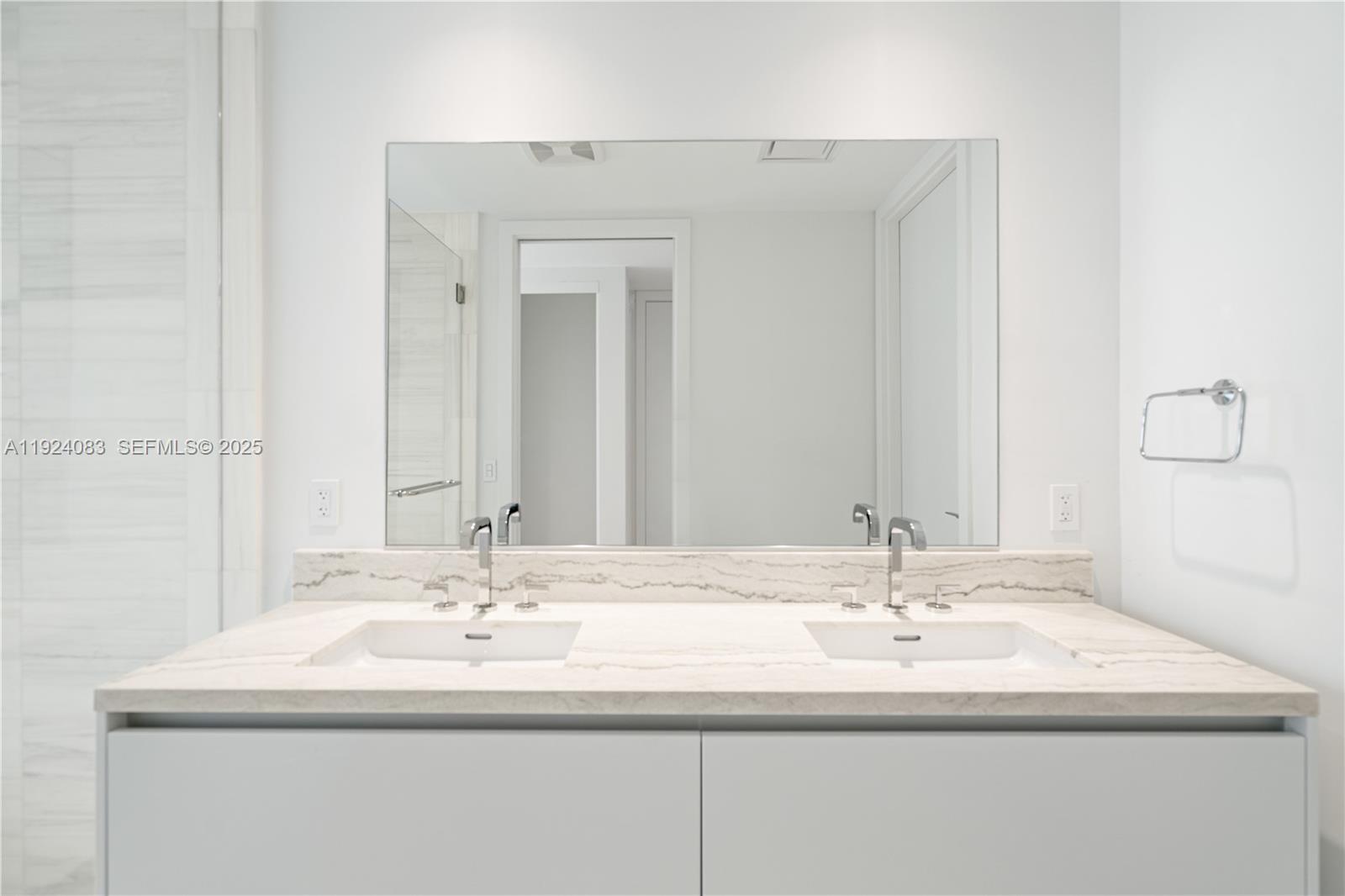 700 Northeast 26th Terrace, Unit 1406 Miami, FL 33137 - Photo 16 of 41 a bathroom with a sink and a mirror