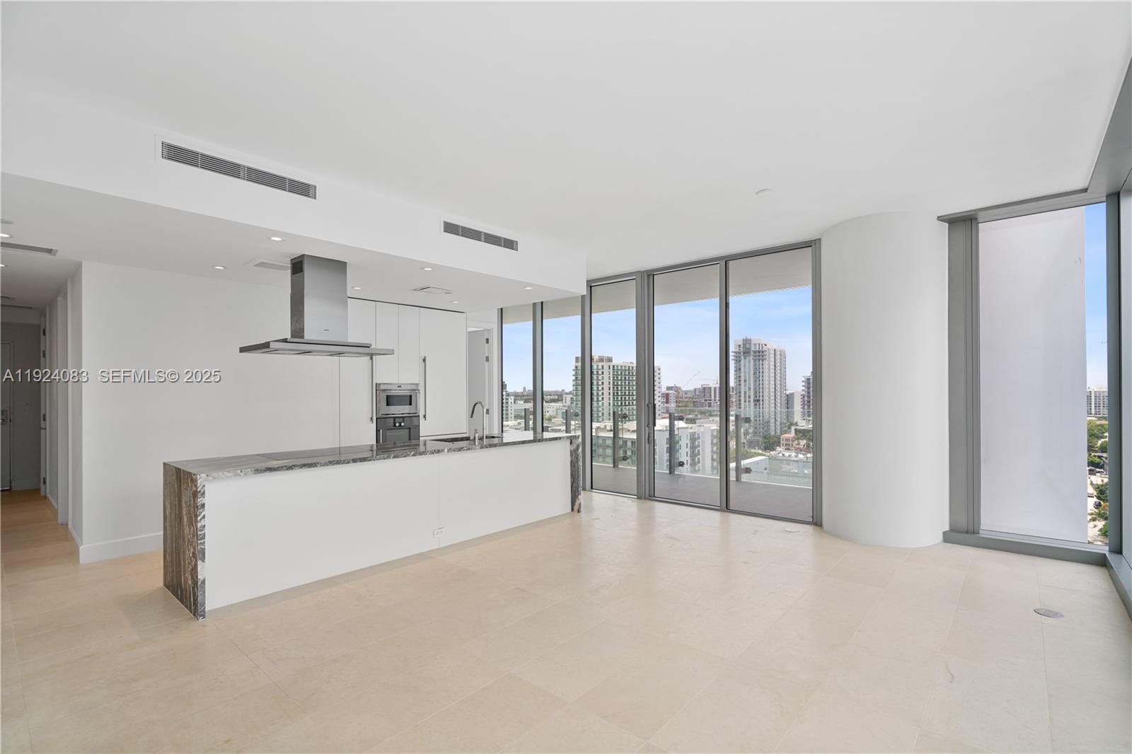 700 Northeast 26th Terrace, Unit 1406 Miami, FL 33137 - Photo 2 of 41 a large white bed in a white room