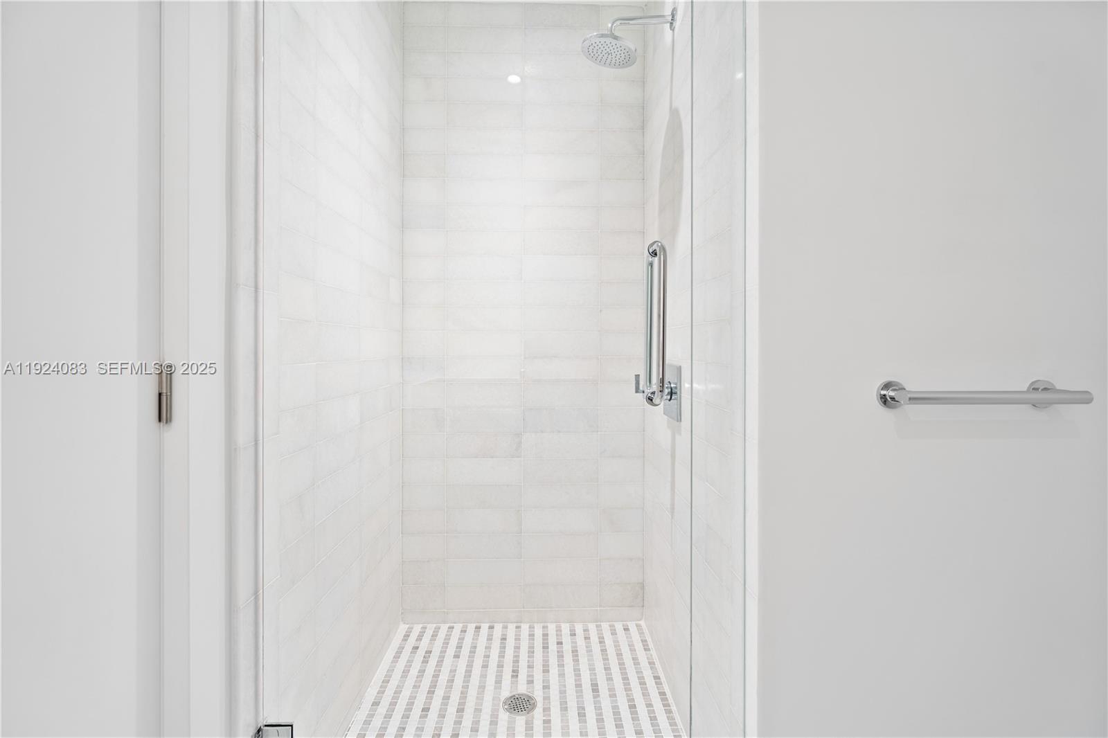 700 Northeast 26th Terrace, Unit 1406 Miami, FL 33137 - Photo 22 of 41 a bathroom with a shower