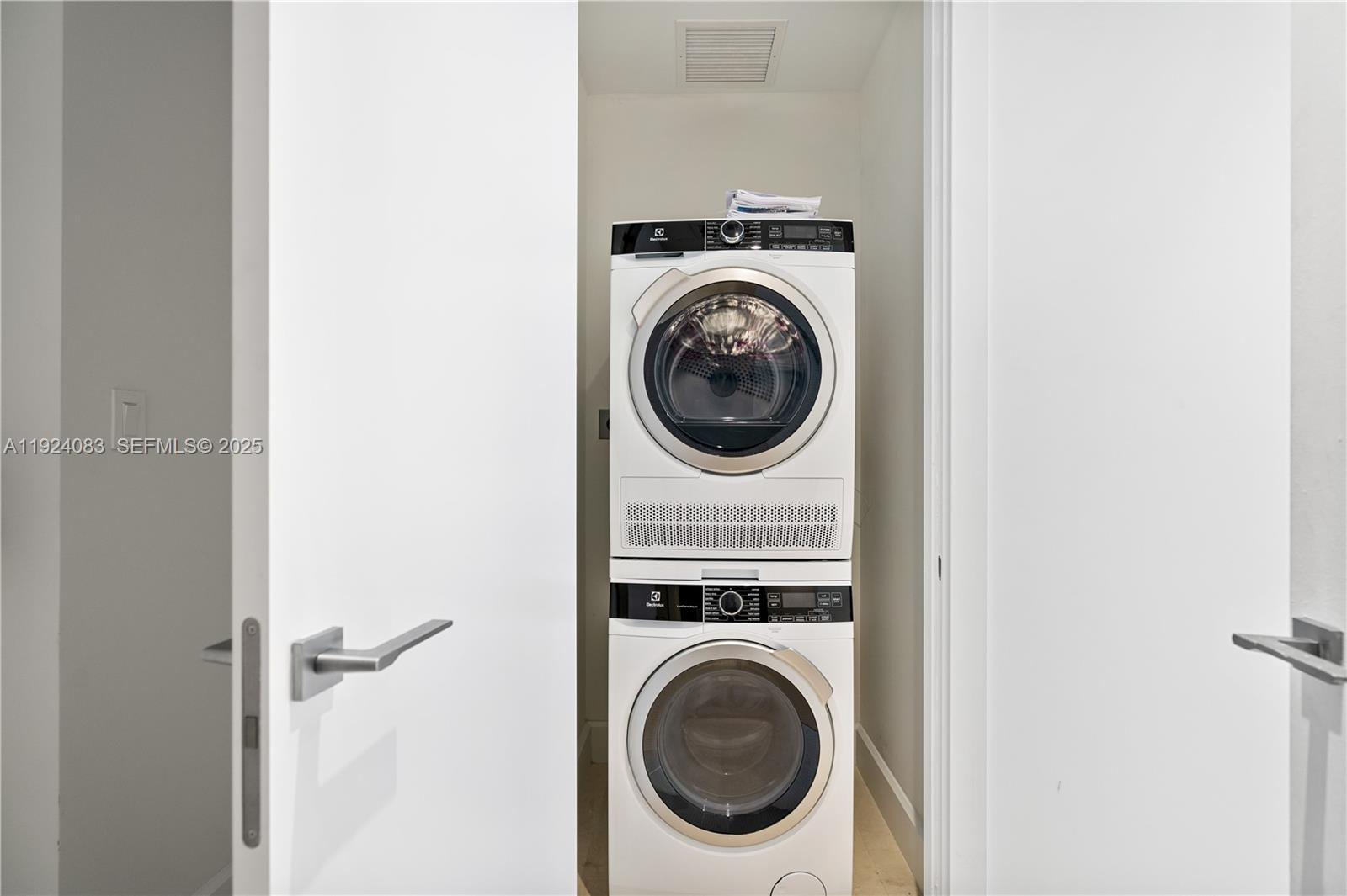 700 Northeast 26th Terrace, Unit 1406 Miami, FL 33137 - Photo 9 of 41 a utility room with dryer and washer