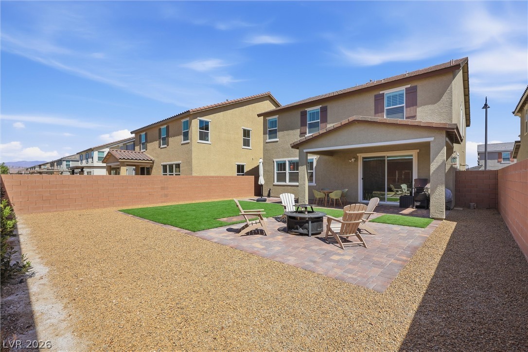 3705 Alla Rocca Avenue Henderson, NV 89044 - Photo 36 of 50 This spacious backyard provides a versatile outdoor living area perfect for relaxation and entertainment.