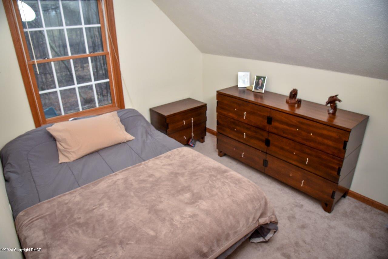 264 Kirkham Road Bushkill, PA 18324 - Photo 15 of 21 a bedroom with a bed and a window