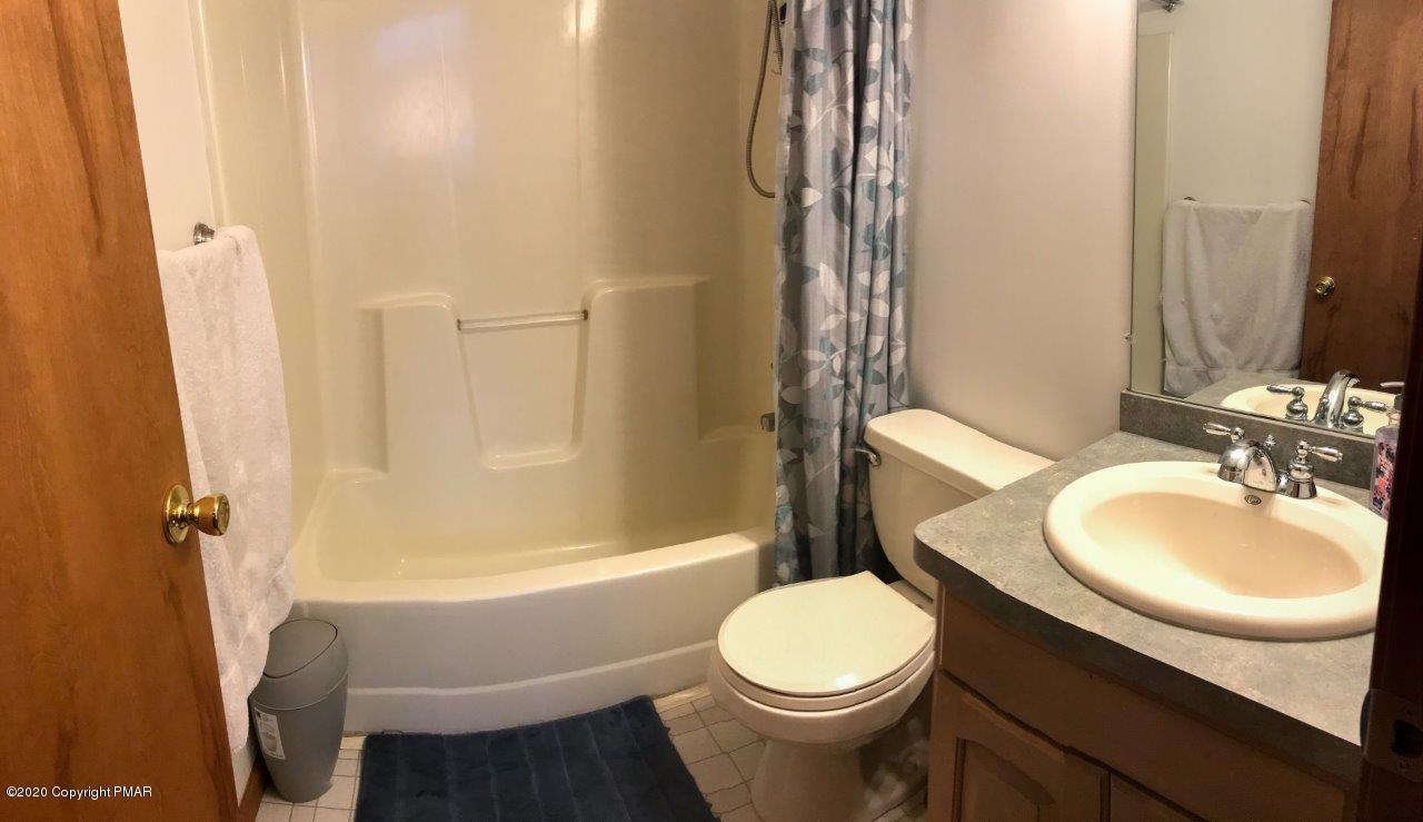 264 Kirkham Road Bushkill, PA 18324 - Photo 17 of 21 a bathroom with a sink a toilet and shower