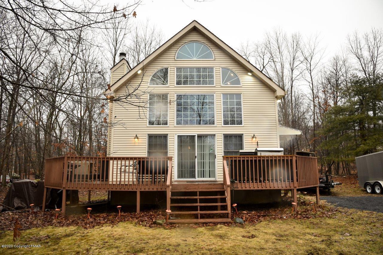264 Kirkham Road Bushkill, PA 18324 - Photo 20 of 21 a view of a house with a yard and deck