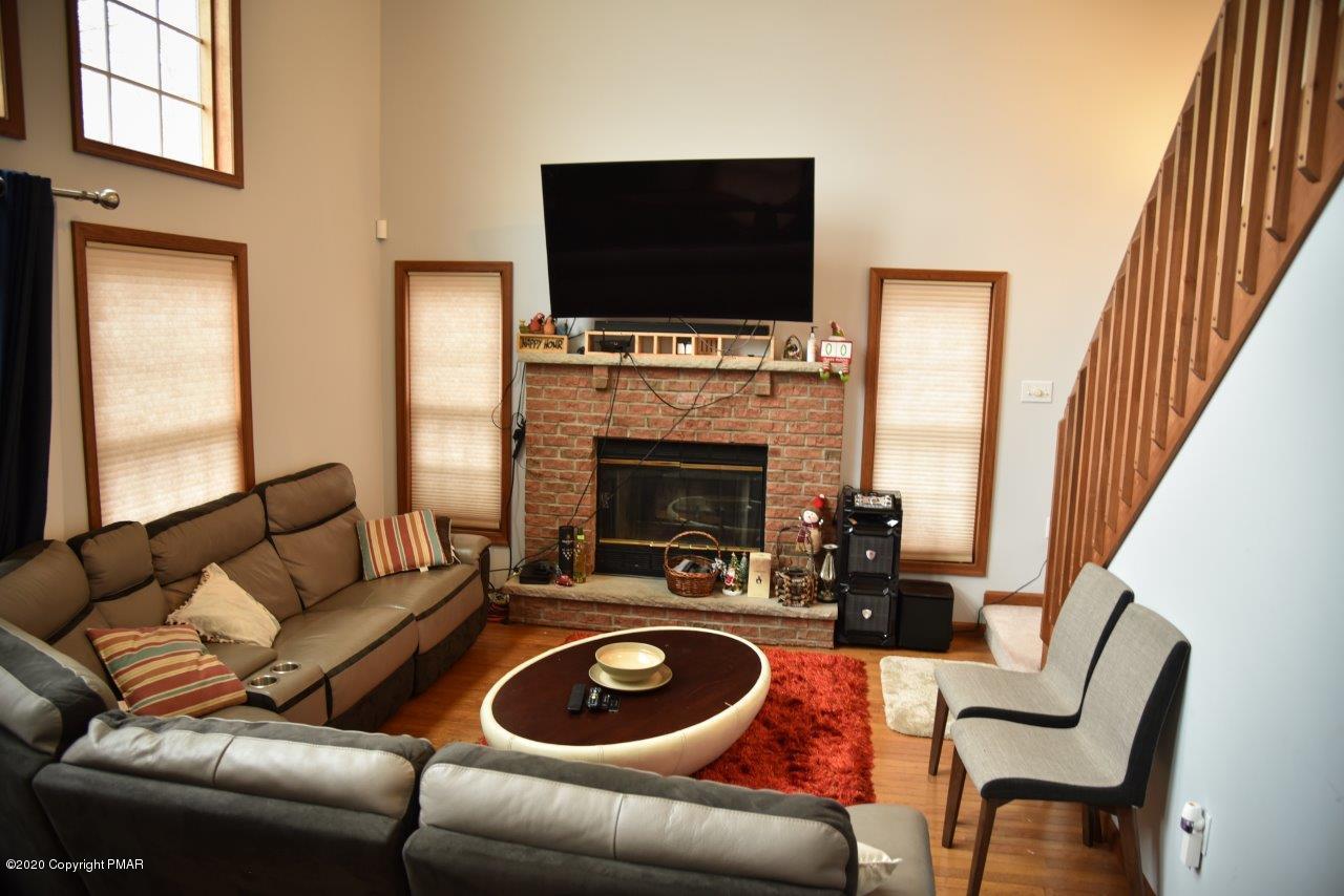 264 Kirkham Road Bushkill, PA 18324 - Photo 3 of 21 a living room with furniture and a flat screen tv