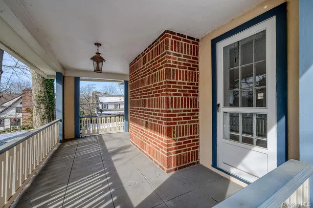 a view of entryway with a door and wooden floor