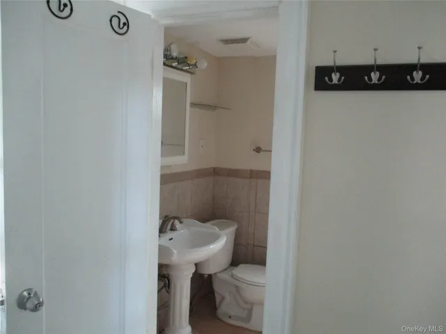 a bathroom with a sink and toilet