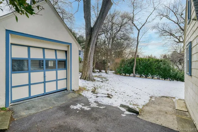 a view of a house with a snow in the yard