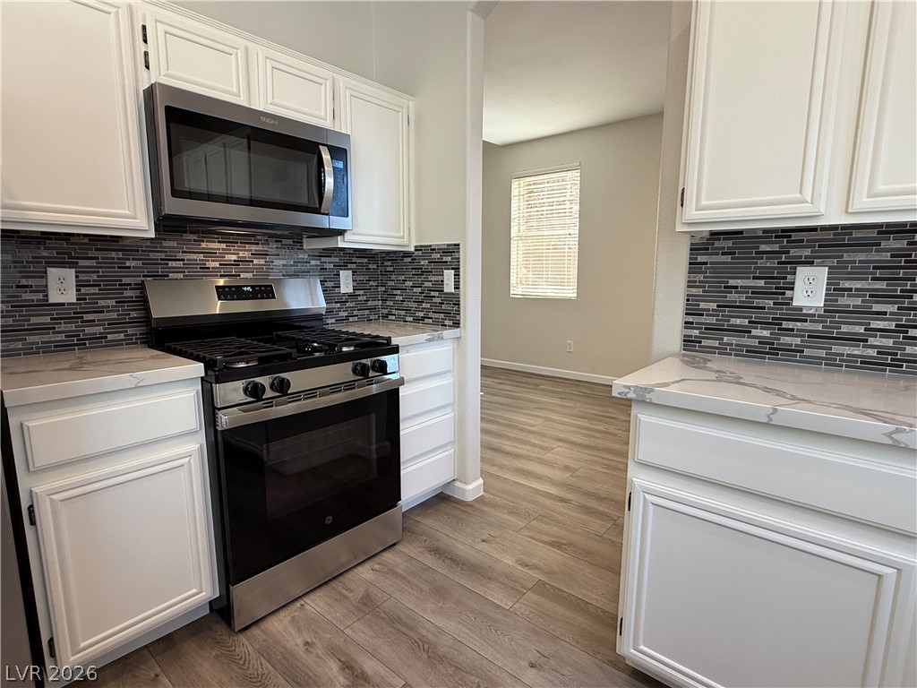 1908 Thunder Ridge Circle Henderson, NV 89012 - Photo 6 of 28 Culinary delights await in this modern kitchen, featuring stainless steel appliances and ample counter space.