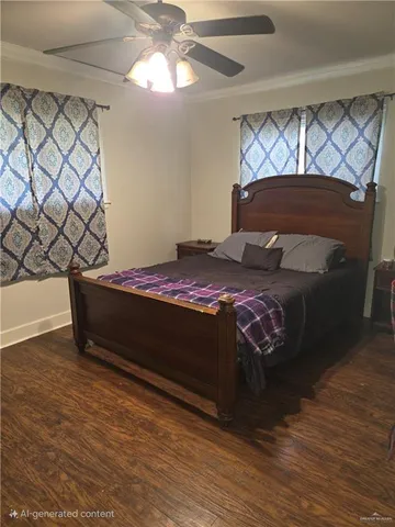 a bed sitting in a bedroom next to a window and a chandelier