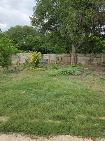a view of a tiny house with a yard